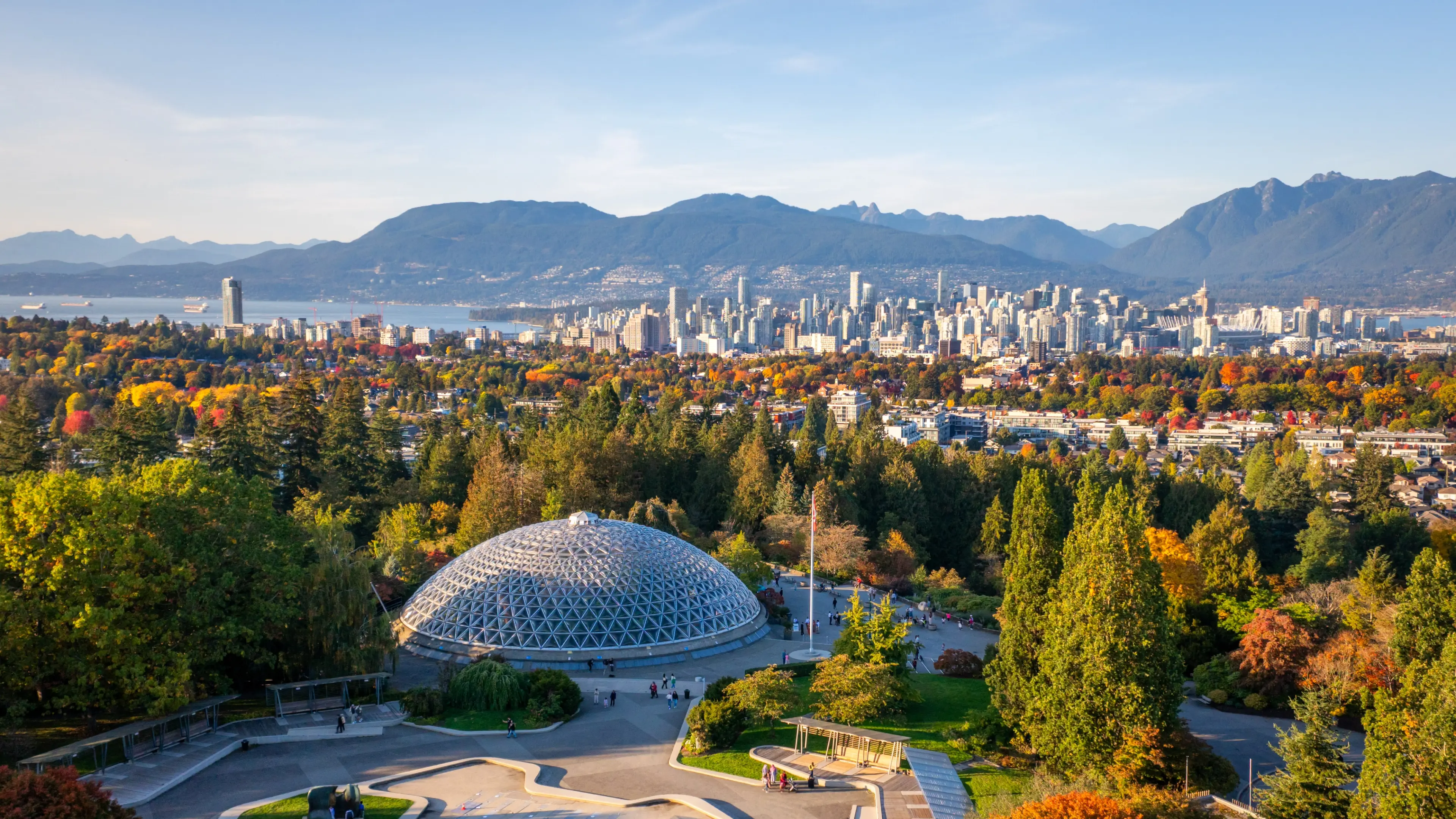 Scenic views of Queen Elizabeth Park from above with Mountains in the background.
