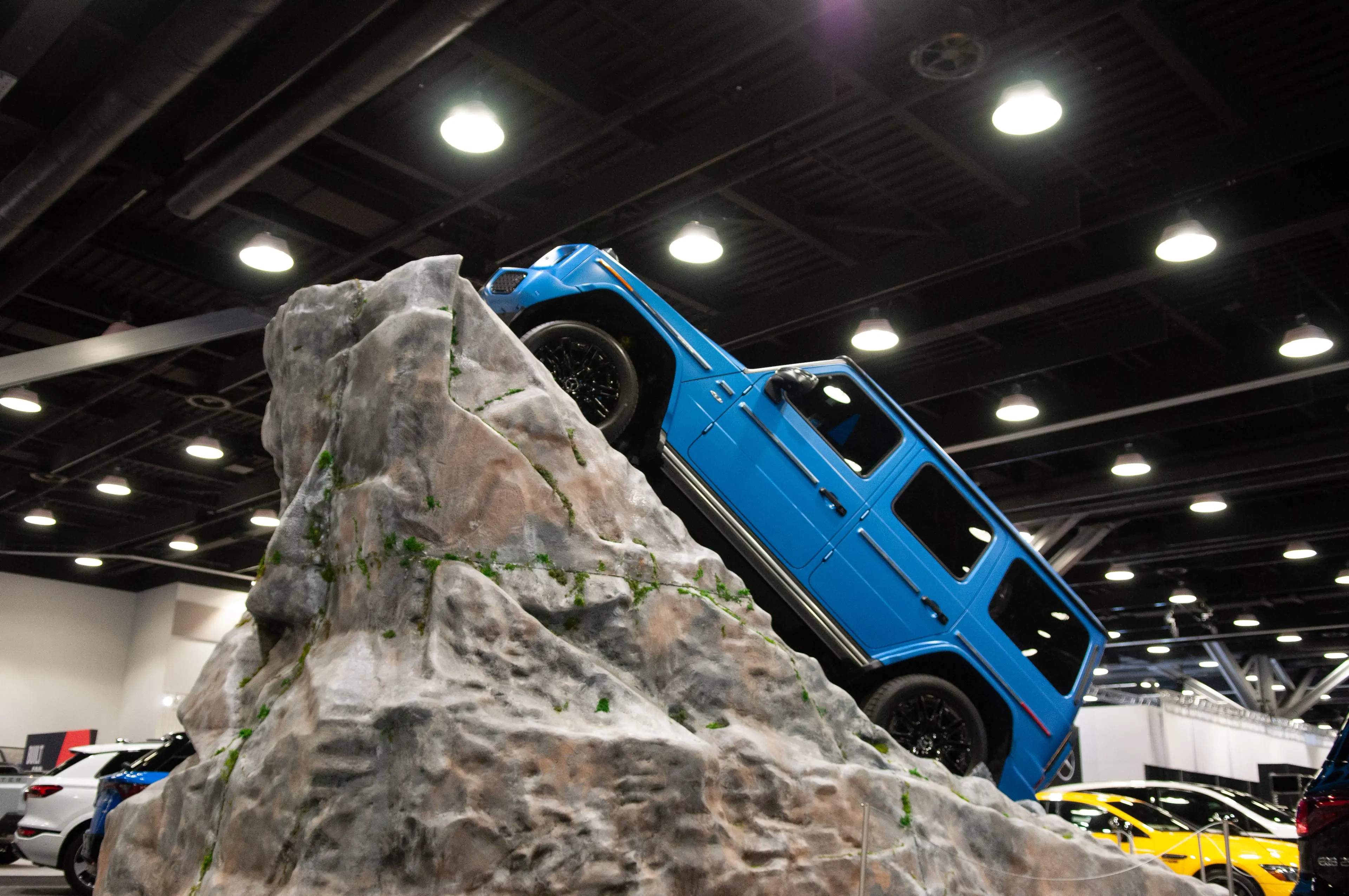 A car placed on a bolder at the Vancouver International Auto Show.