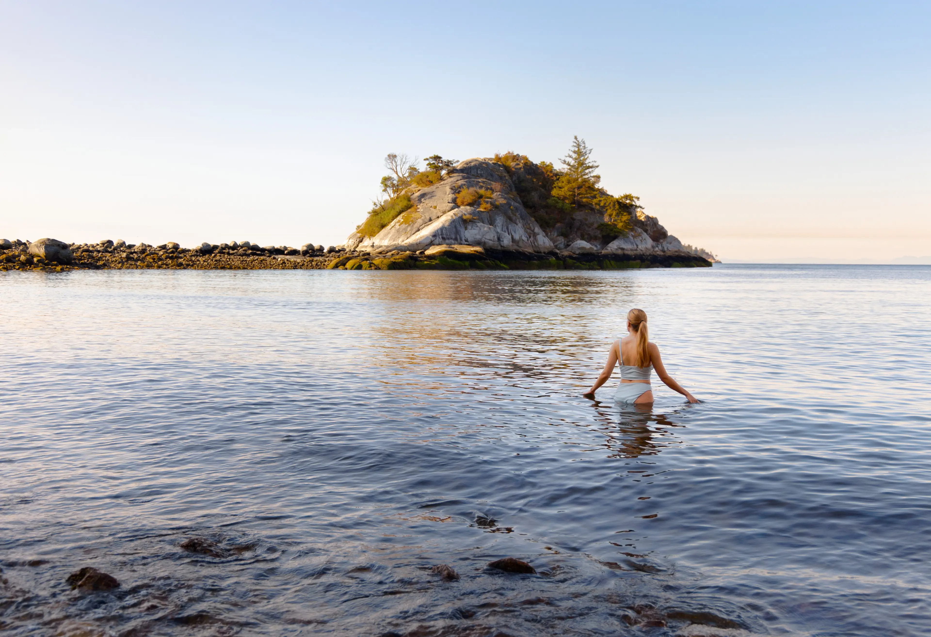 A woman swims in the ocean at Whytecliff Park in West Vancouver. 