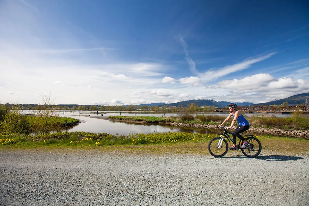 Cycling on the Pitt River Greenway in Vancouver
