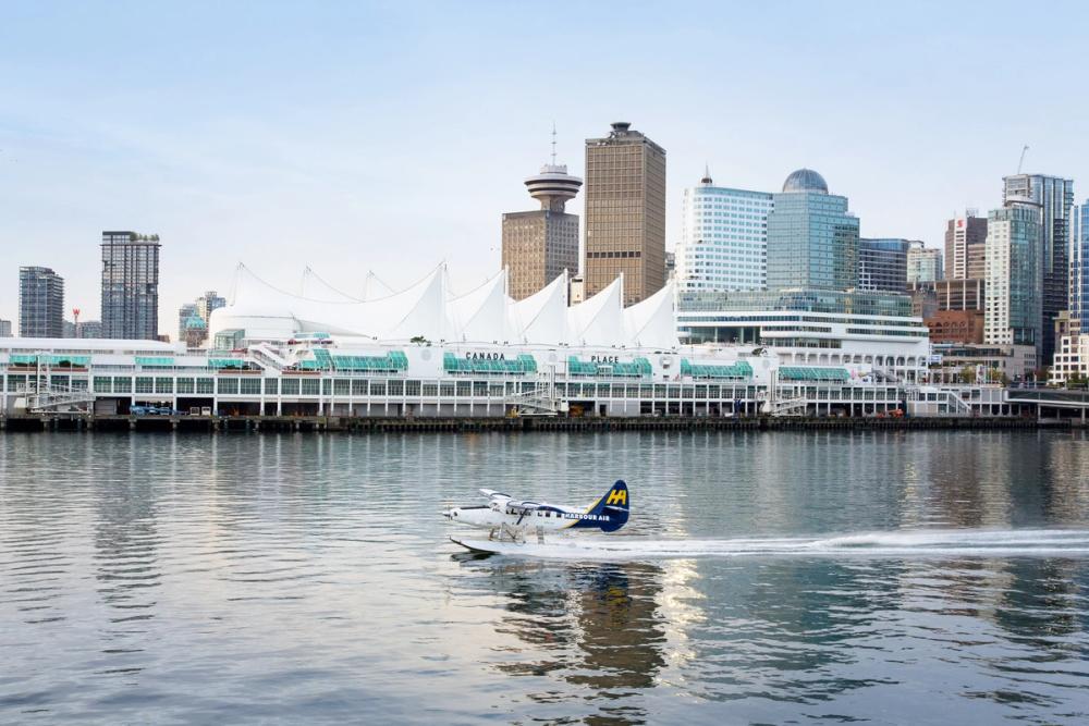 Seaplane taking off in front of Canada Place