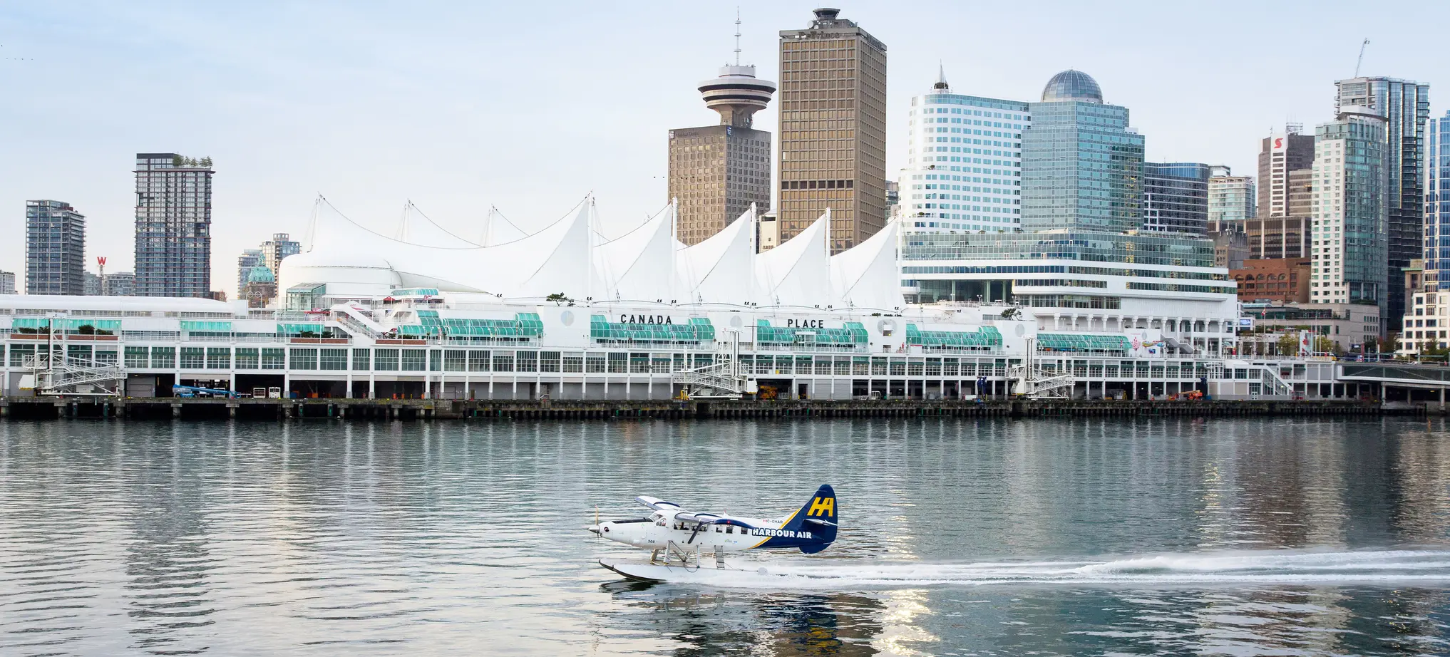 Seaplane taking off in front of Canada Place