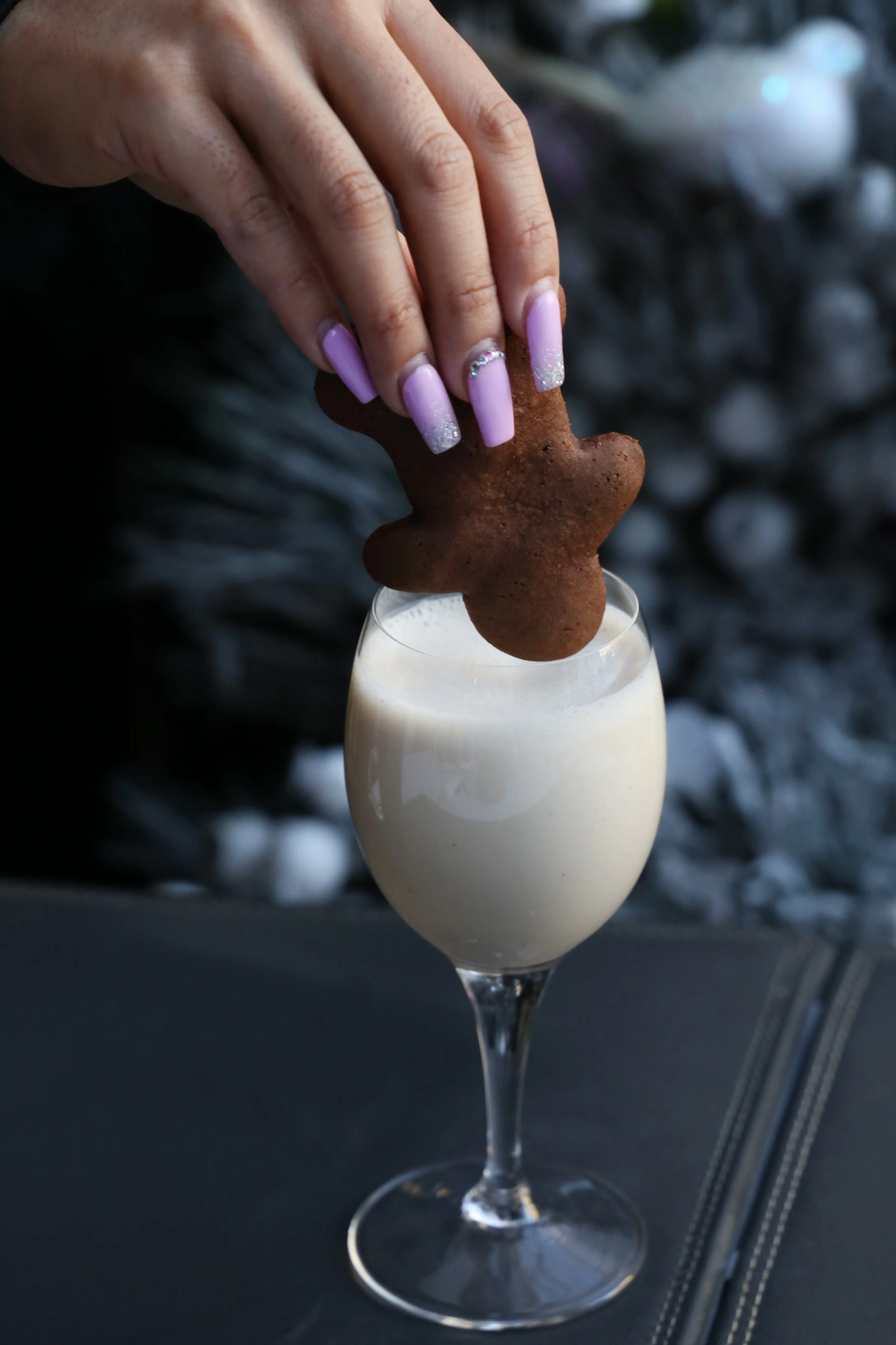 Dunking a gingerbread in eggnog at Glowbal