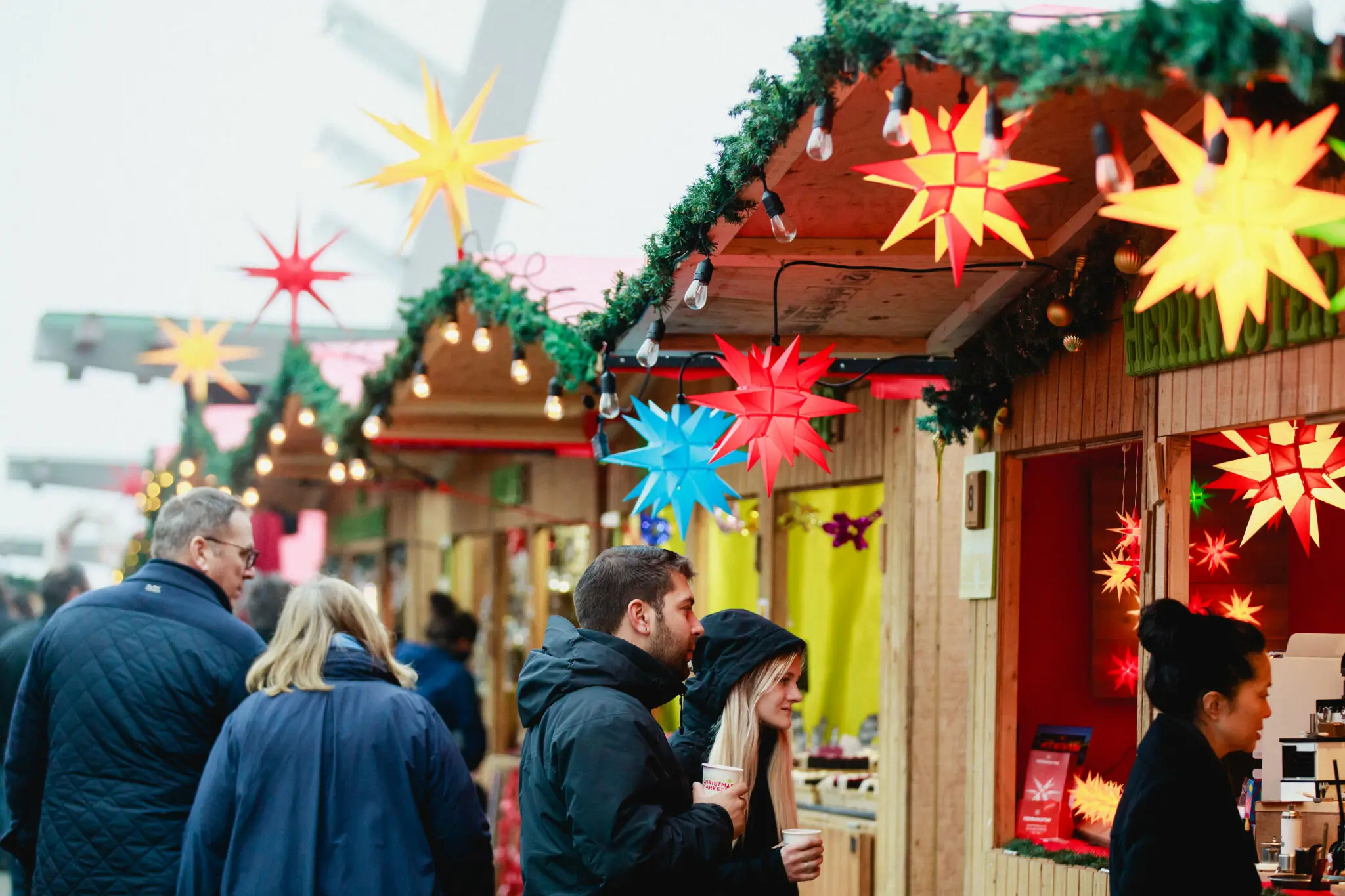 A couple peruses the vendors at the Vancouver Christmas Market