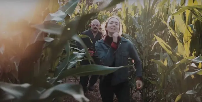 A woman runs from a man in costume at the Maan Farms Haunted Corn Maze near Vancouver