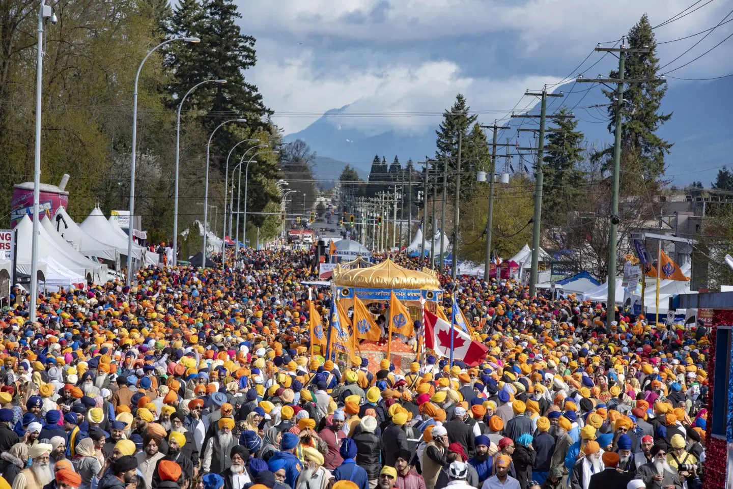 Crowds surround a float the Surrey Vaisakhi parade