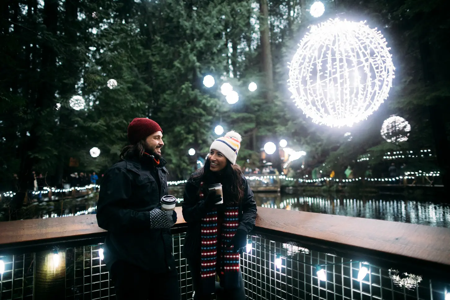 A couple enjoying twinkling lights at Capilano Suspension Bridge in Vancouver