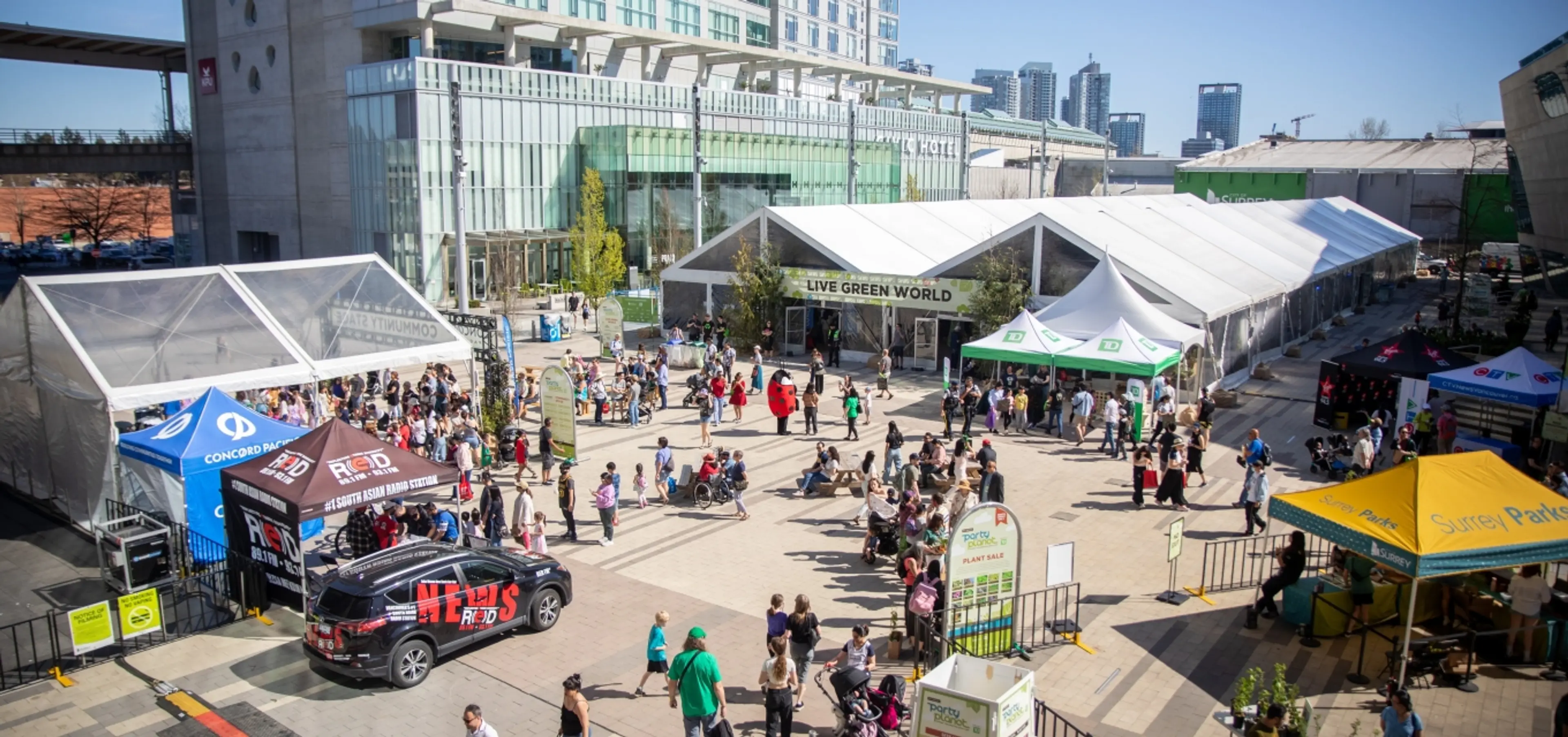 People visit booths at Party for the Planet in Surrey