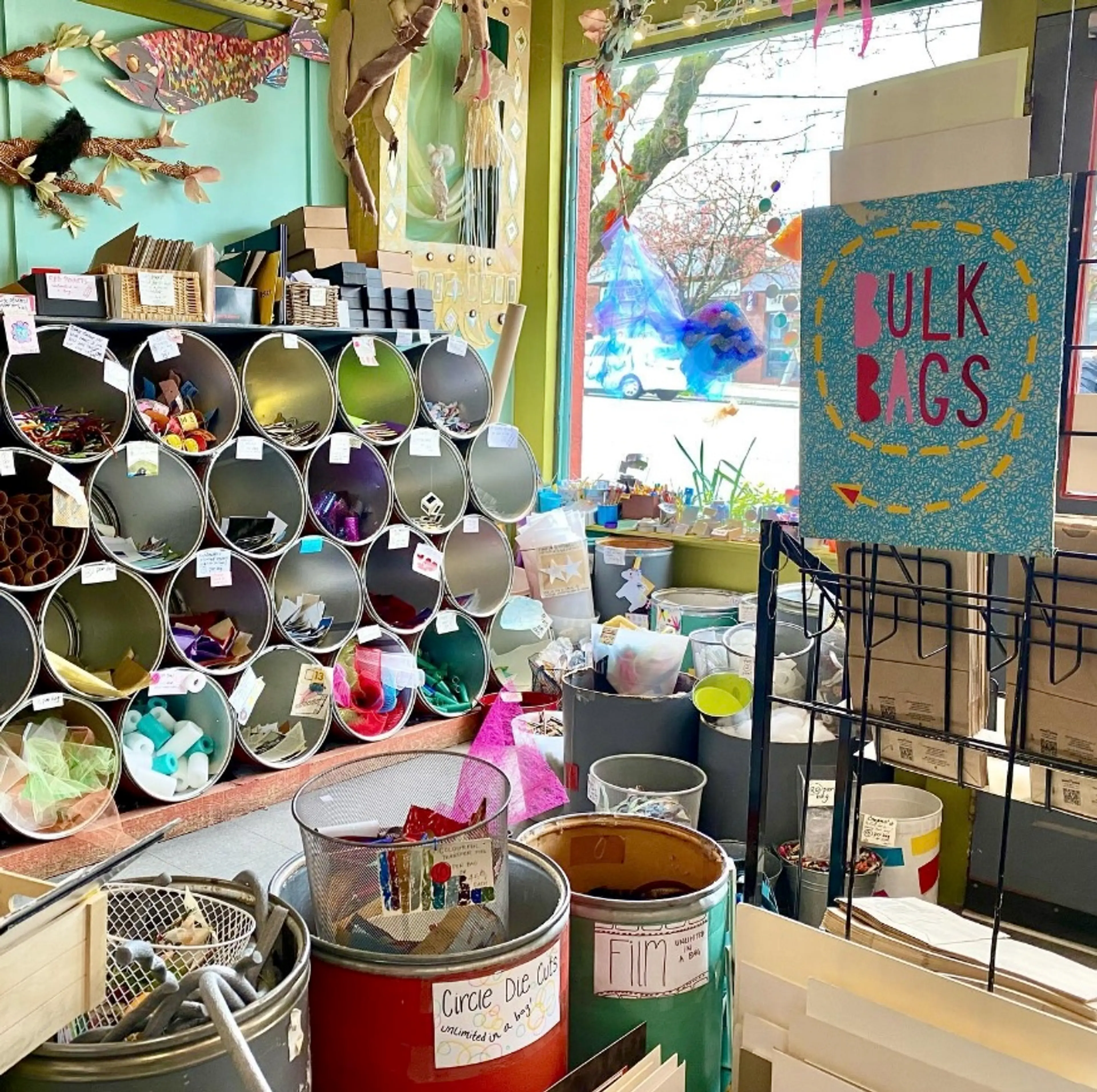 Circular bins of upcycled craft supplies on display at Urban Source in Vancouver.