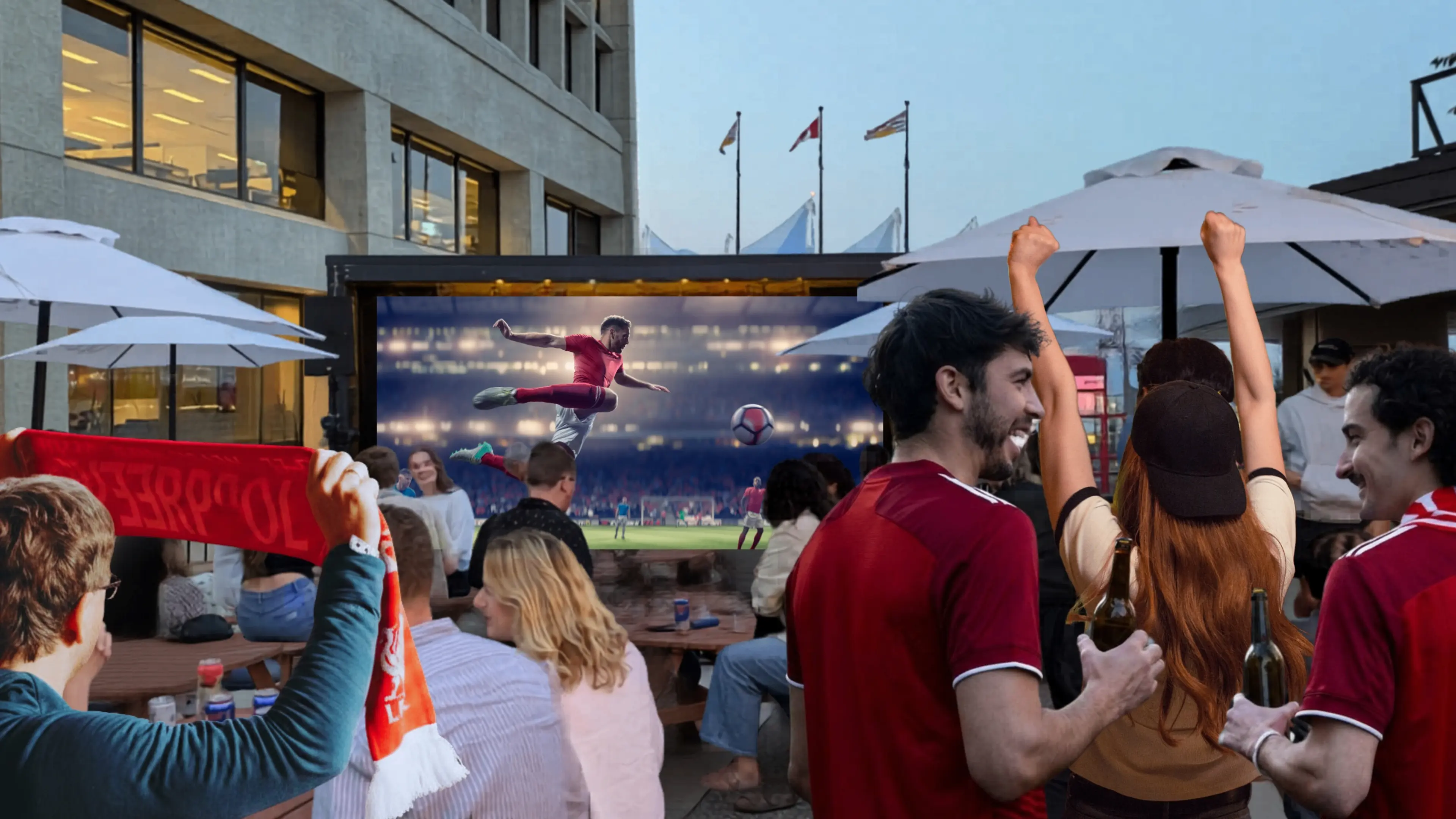 Group of people watching a soccer match on a large outdoor screen, some cheering and holding drinks.