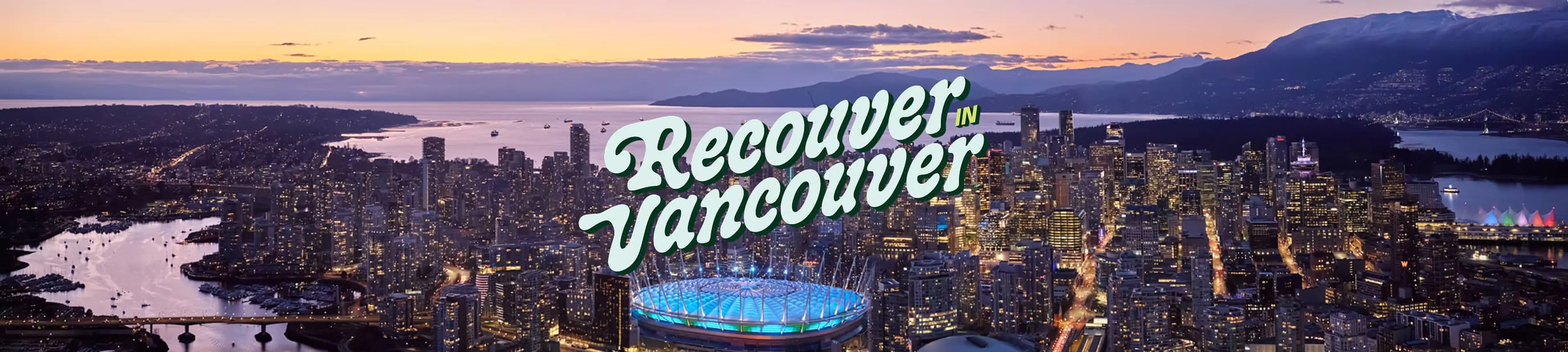 Aerial view of Vancouver city at dusk with illuminated buildings and a stadium, text reads 'Recover in Vancouver'.
