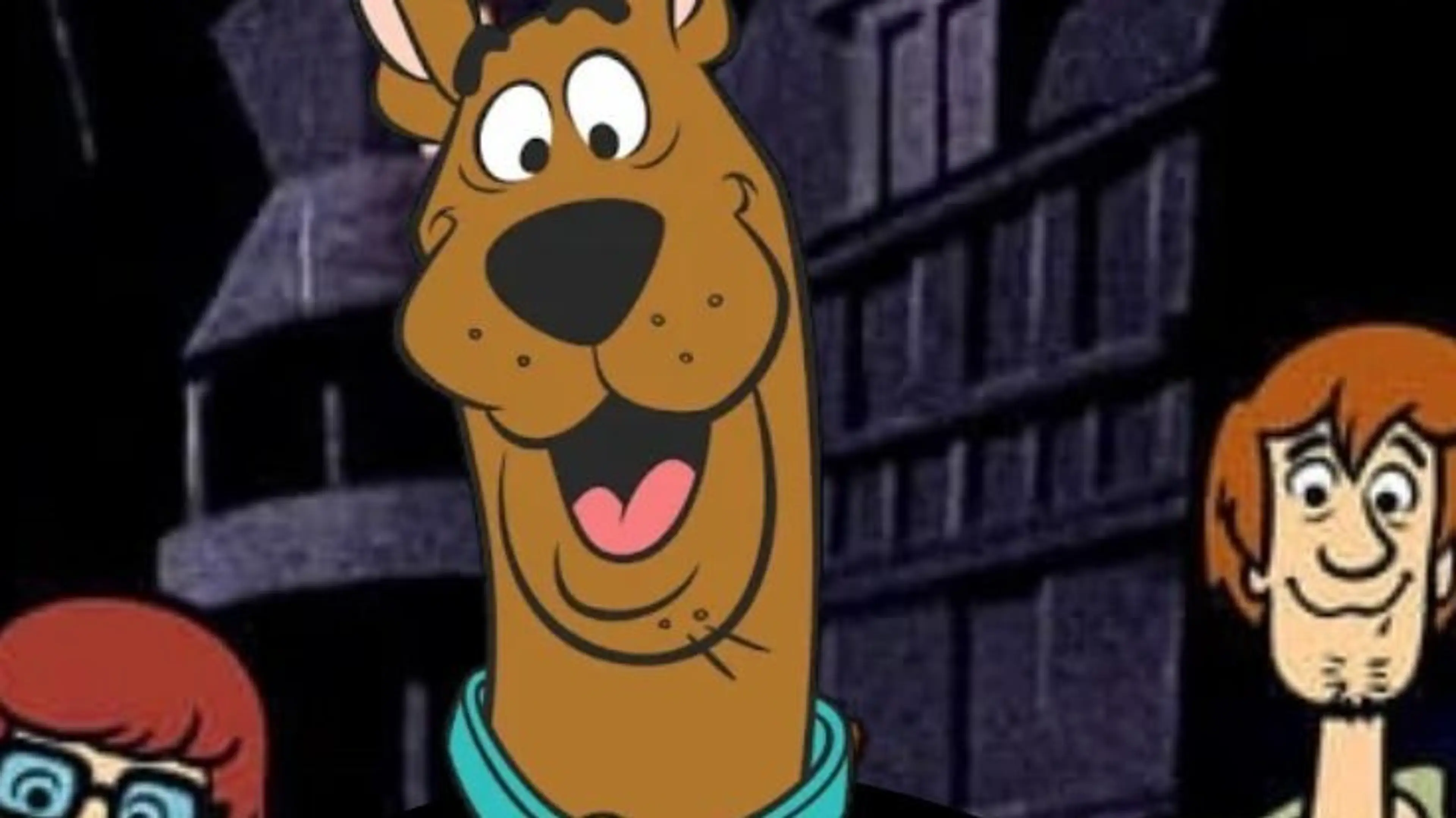 Scooby-Doo with a happy expression, flanked by Velma on the left and Shaggy on the right, in front of a dark, spooky building.