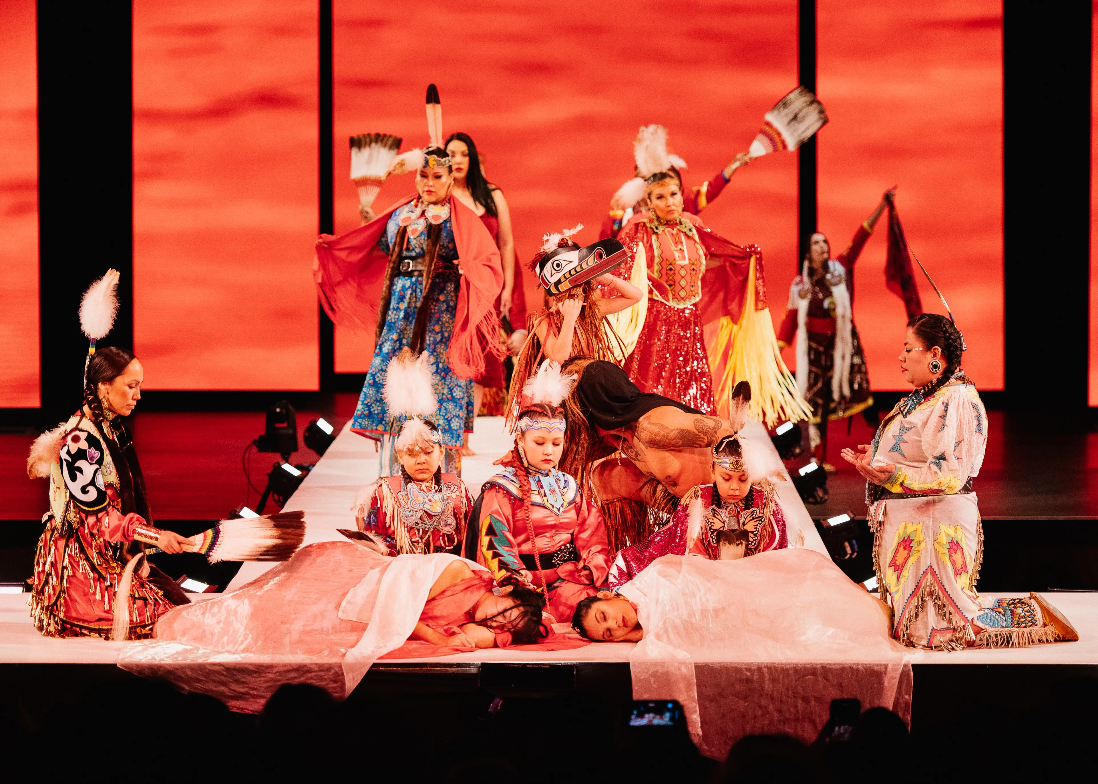 A performance on stage at VIFW as part of Red Dress Night, showcasing beauty and resilience