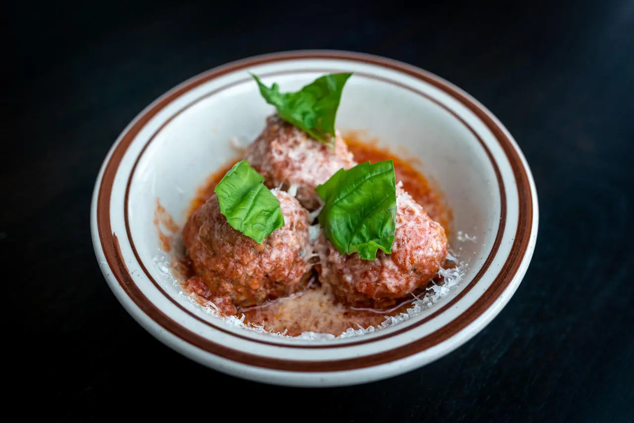 A close up of a bowl of meatballs from the happy hour menu at Bufala