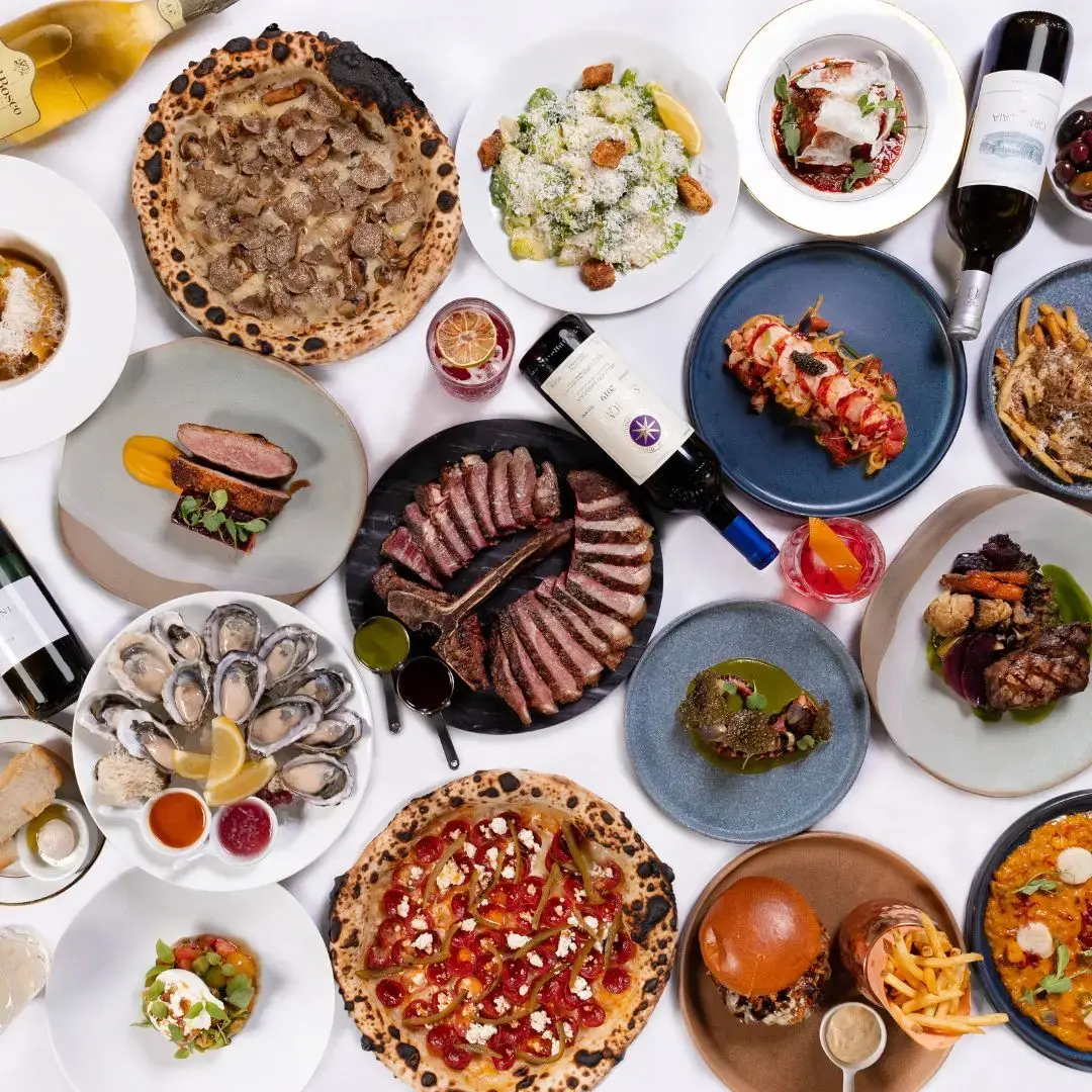 A table filled with various plates at Aquafarina in Vancouver.