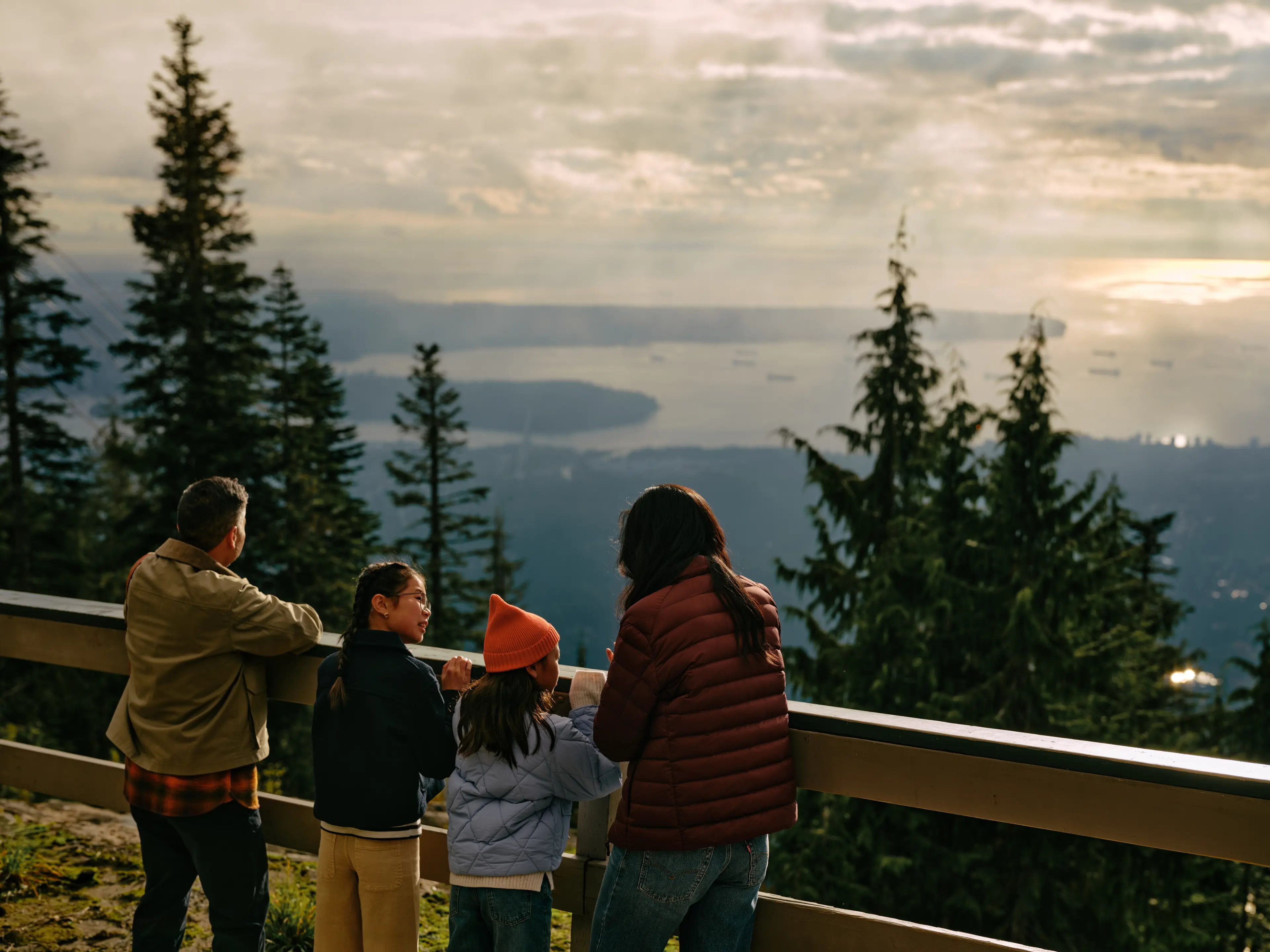 A family looking out at Grouse Mountain in North Vancouver.