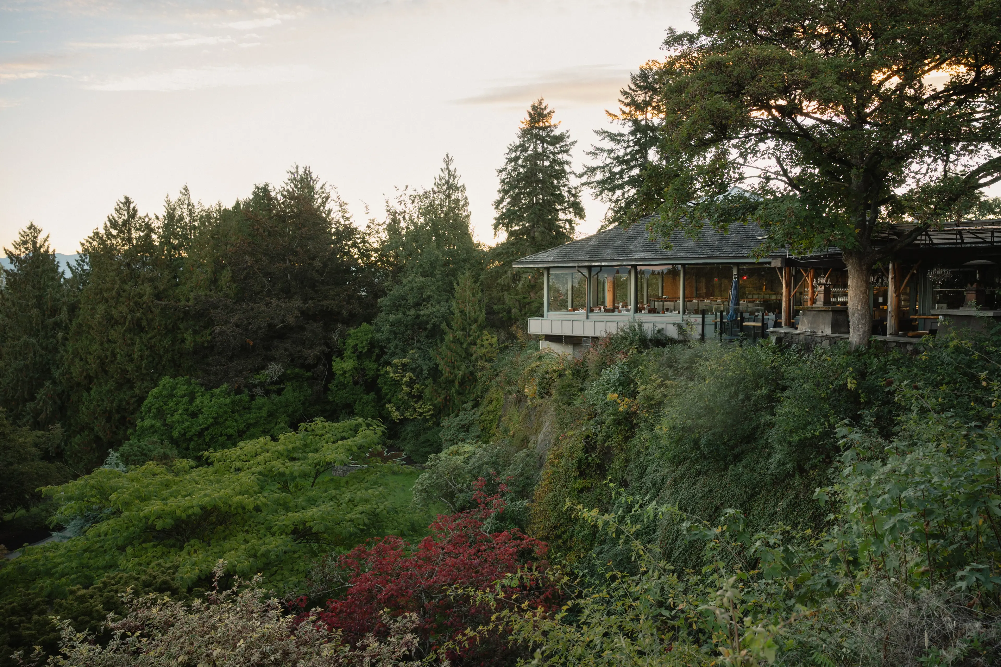 Exterior image of the restaurant Seasons in the Park in romantic dusk lighting in Vancouver.