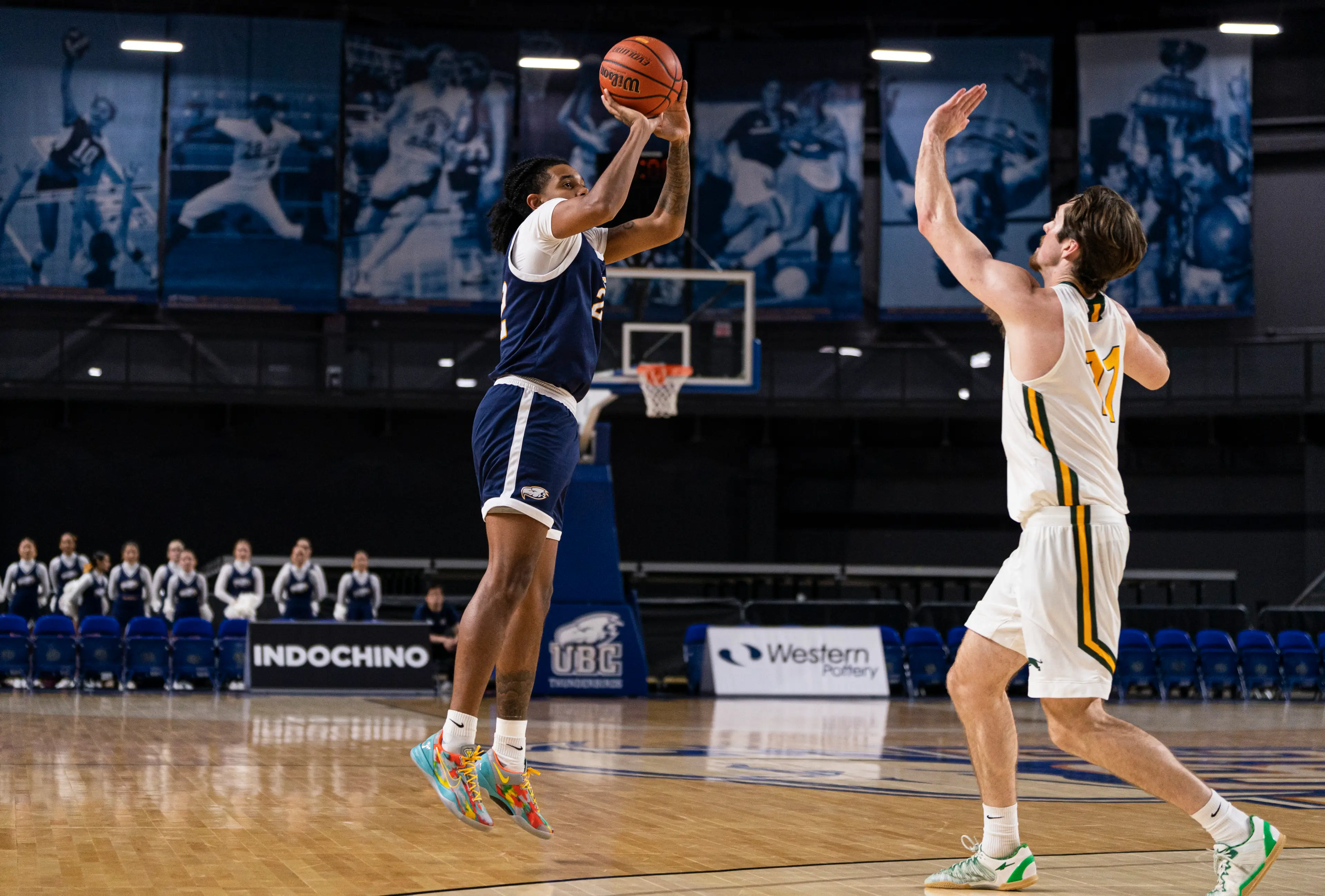 Two men play a basketball game at UBC