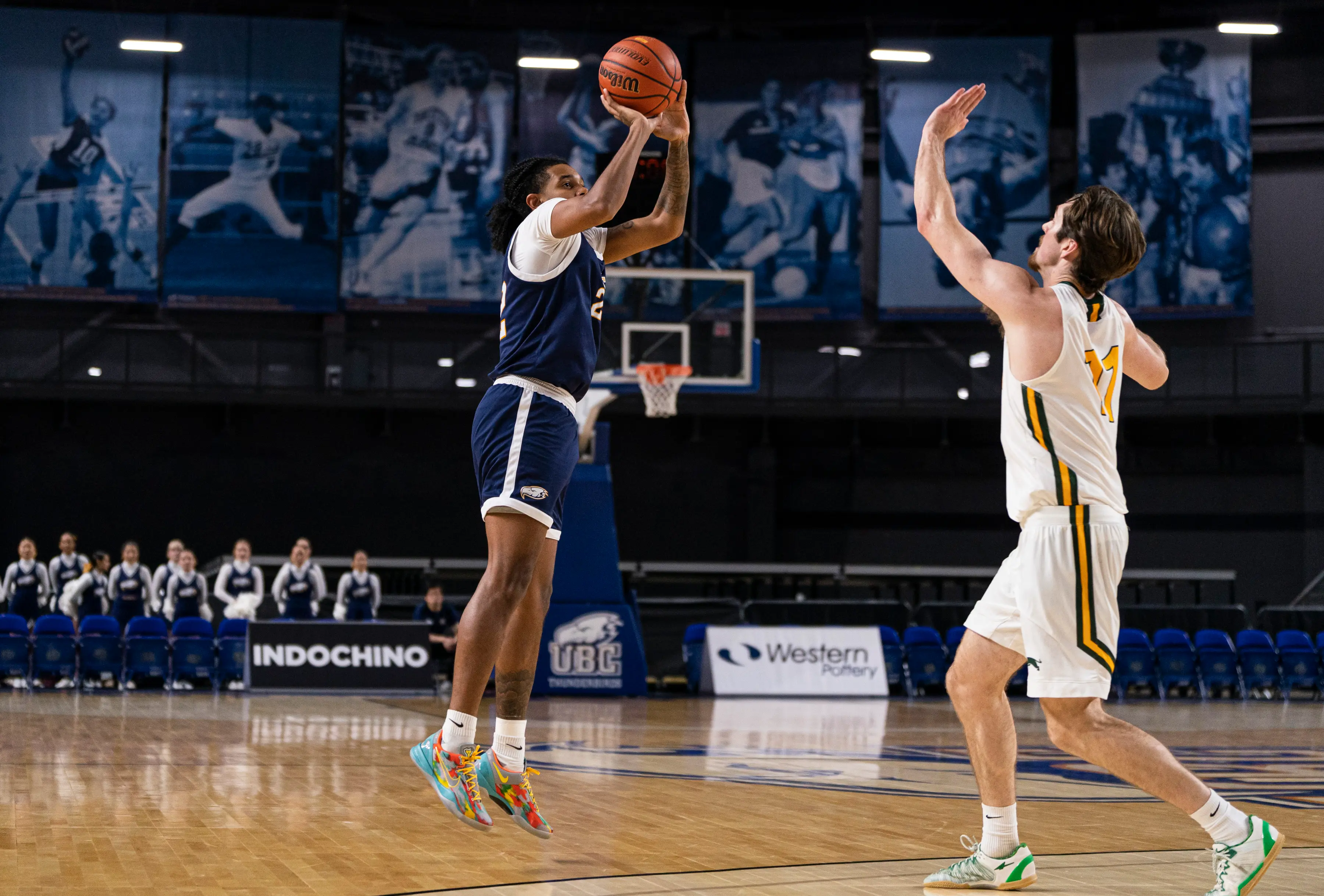 Two men play a basketball game at UBC