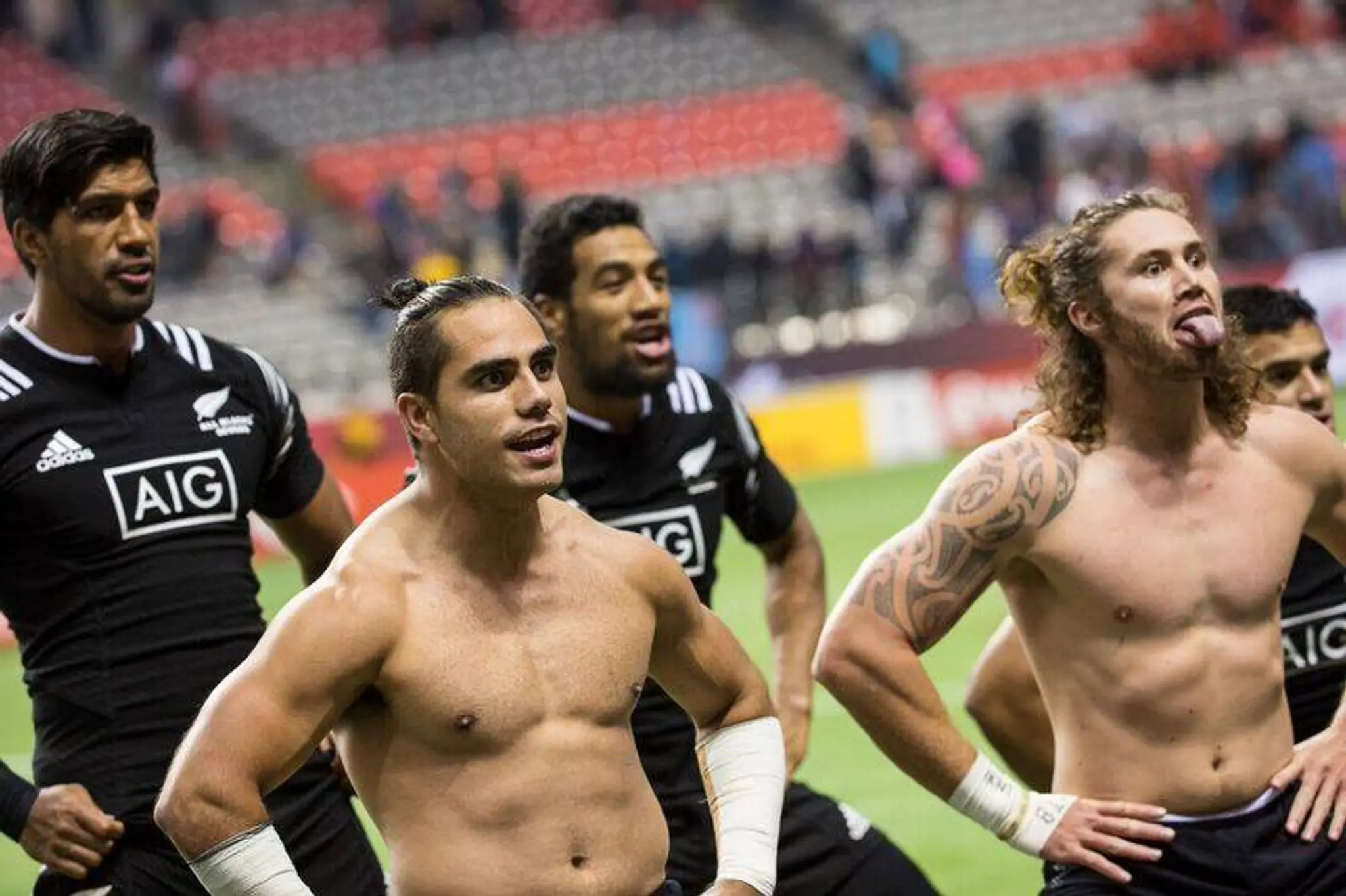 Rugby players posing with hands on hips