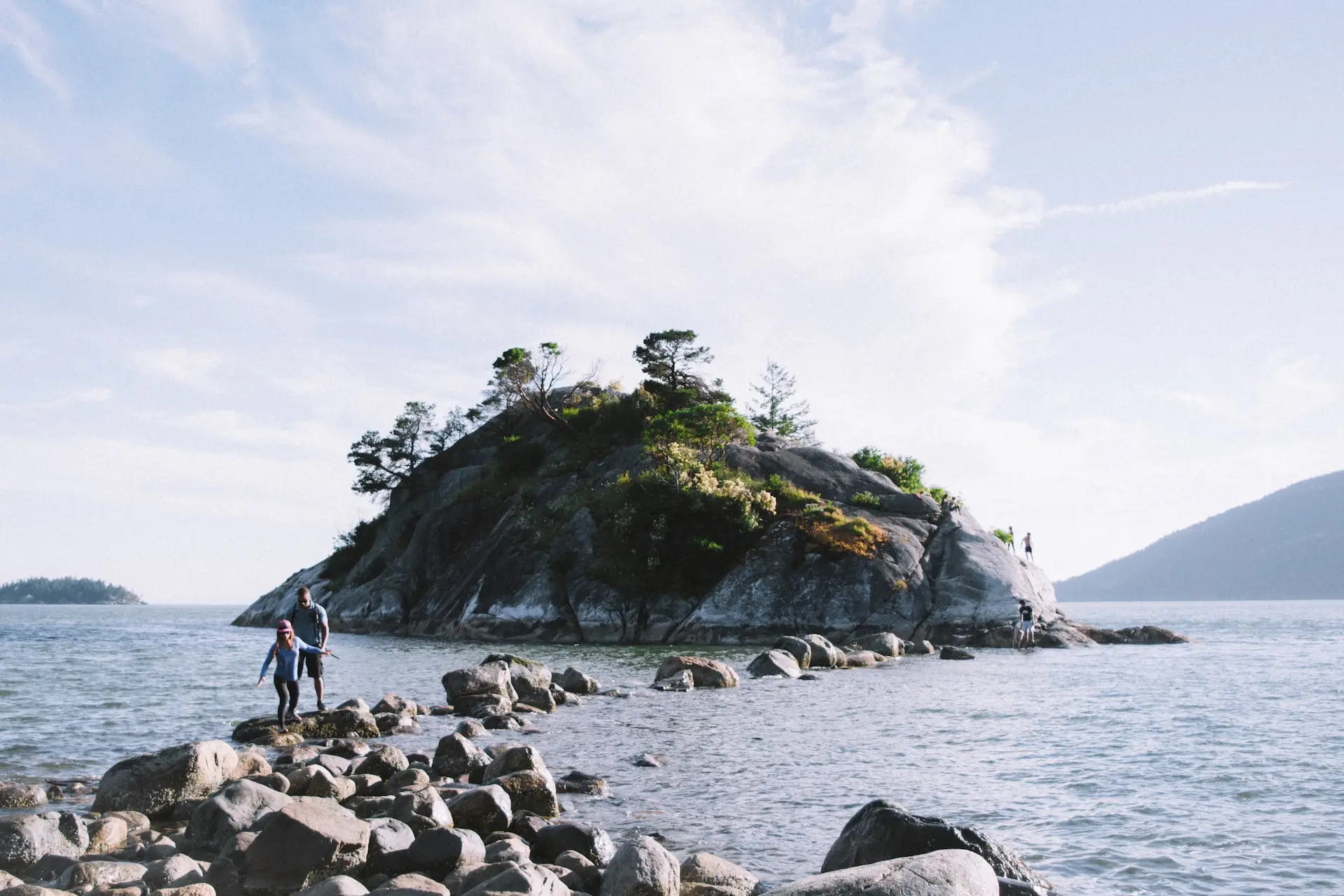 Rock hopping back from Whyte Islet as the tide comes in. Photo: Brayden Law/Unsplash