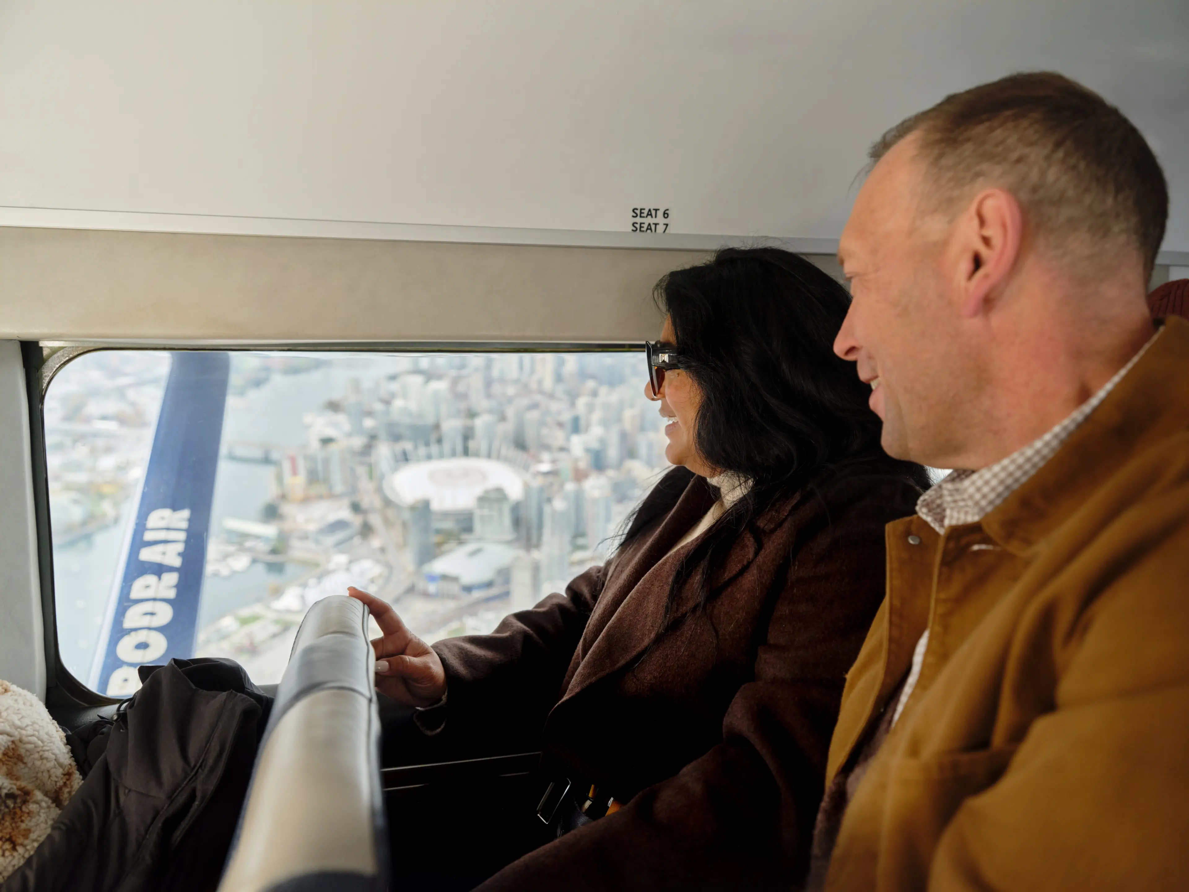 A couple taking a scenic flight with Harbour Air in Vancouver.