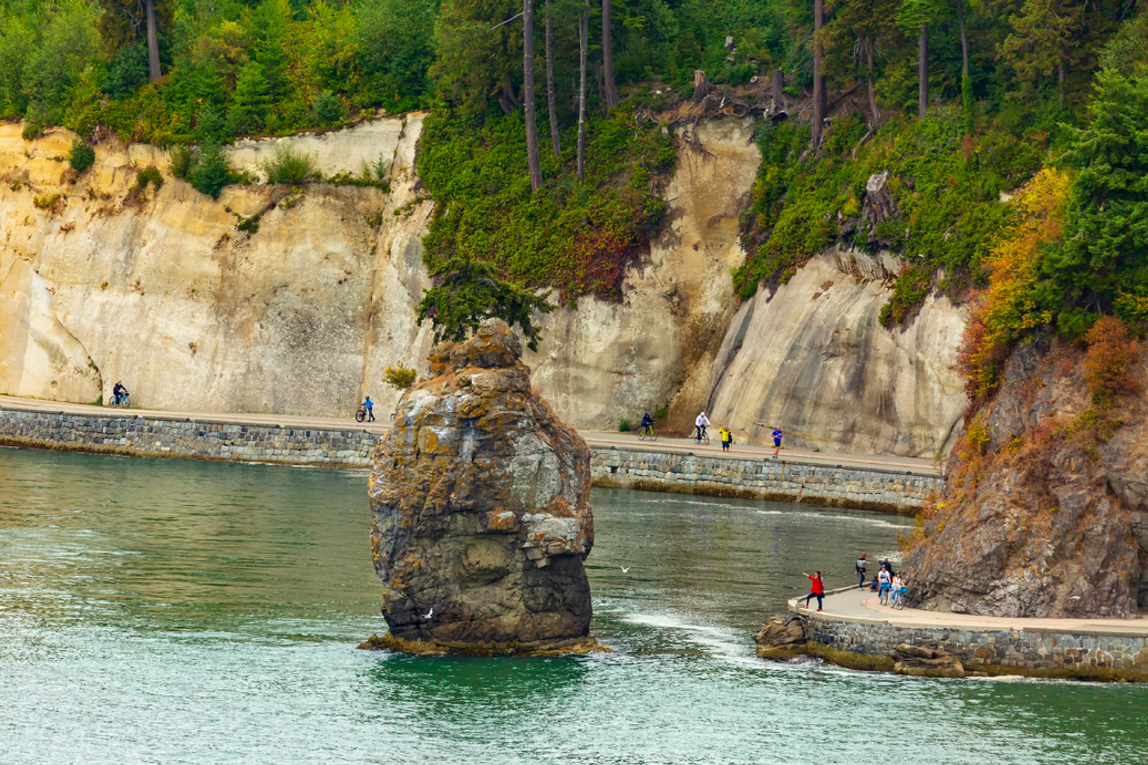 Runners on the Stanley Park Seawall at Siwash Rock