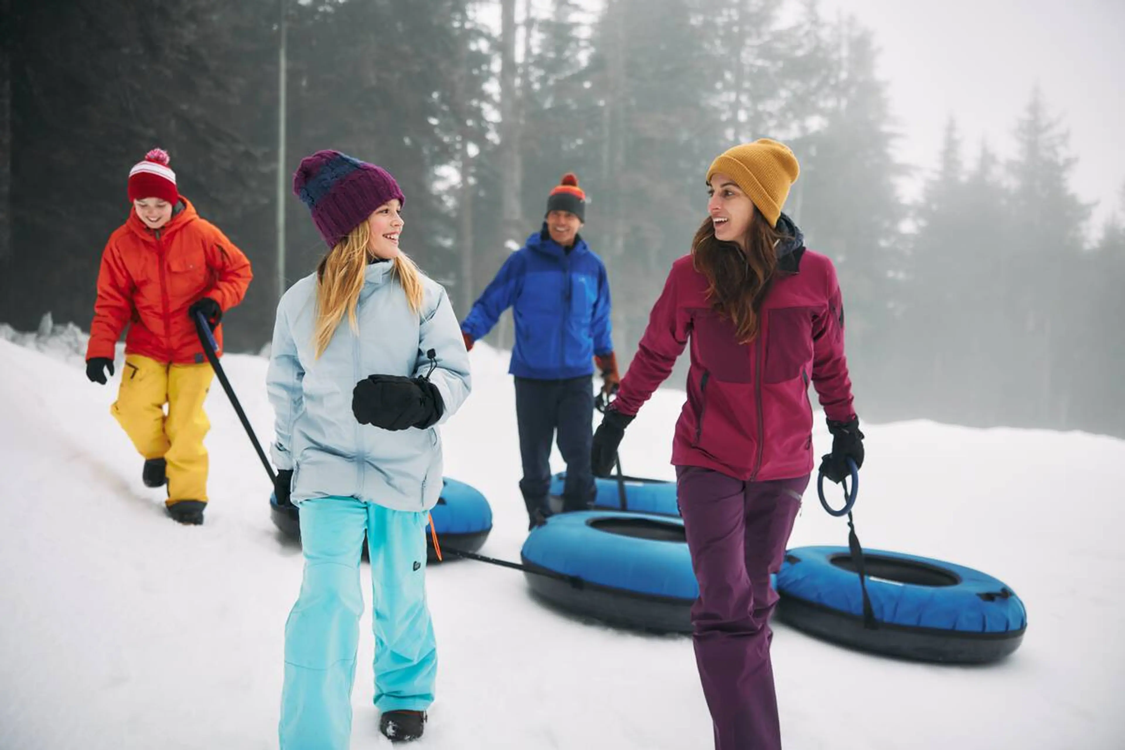 A family preparing to go tubing at Cypress Mountain. 