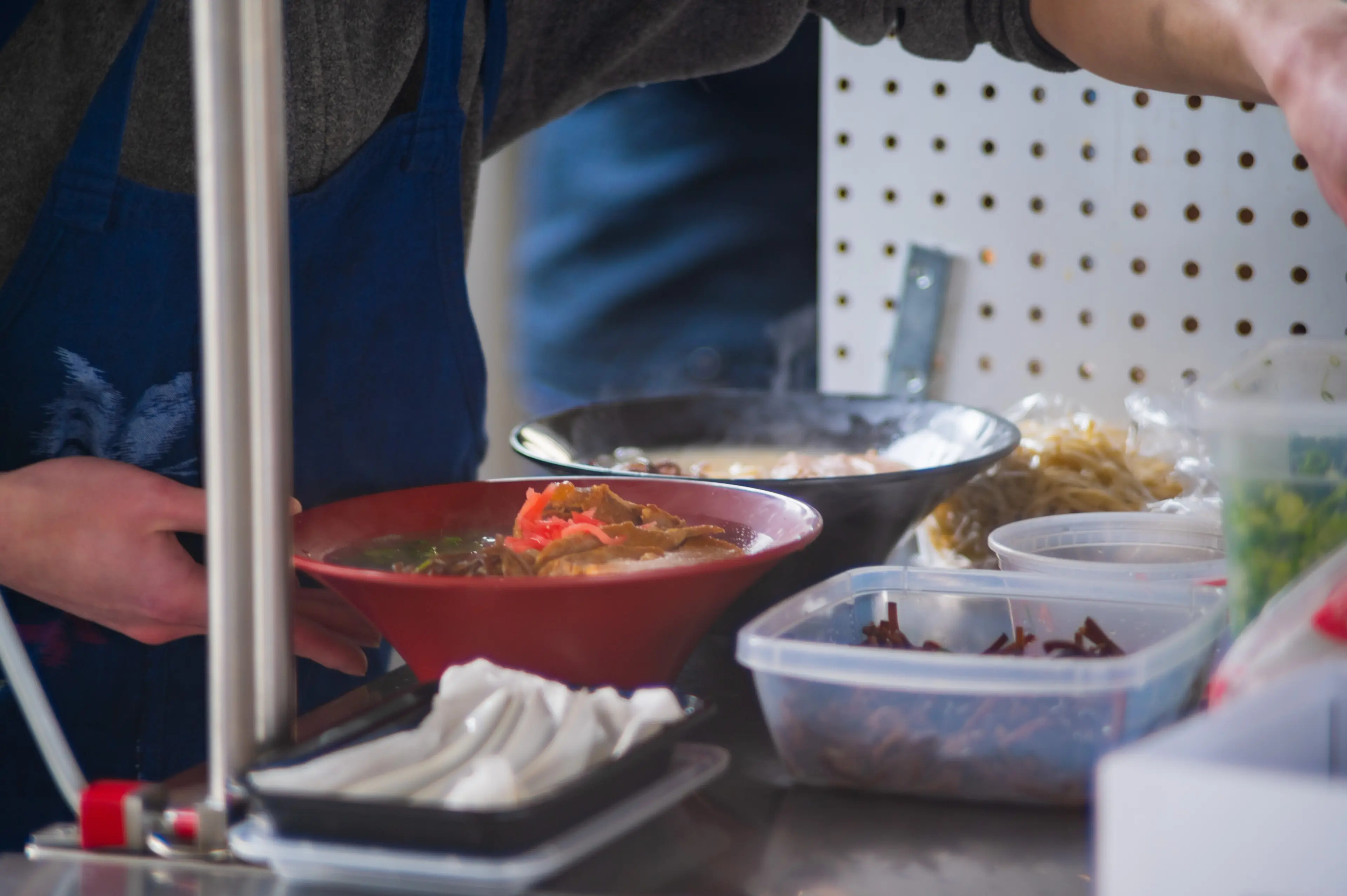 Preparing ramen at Tatchan Noodle