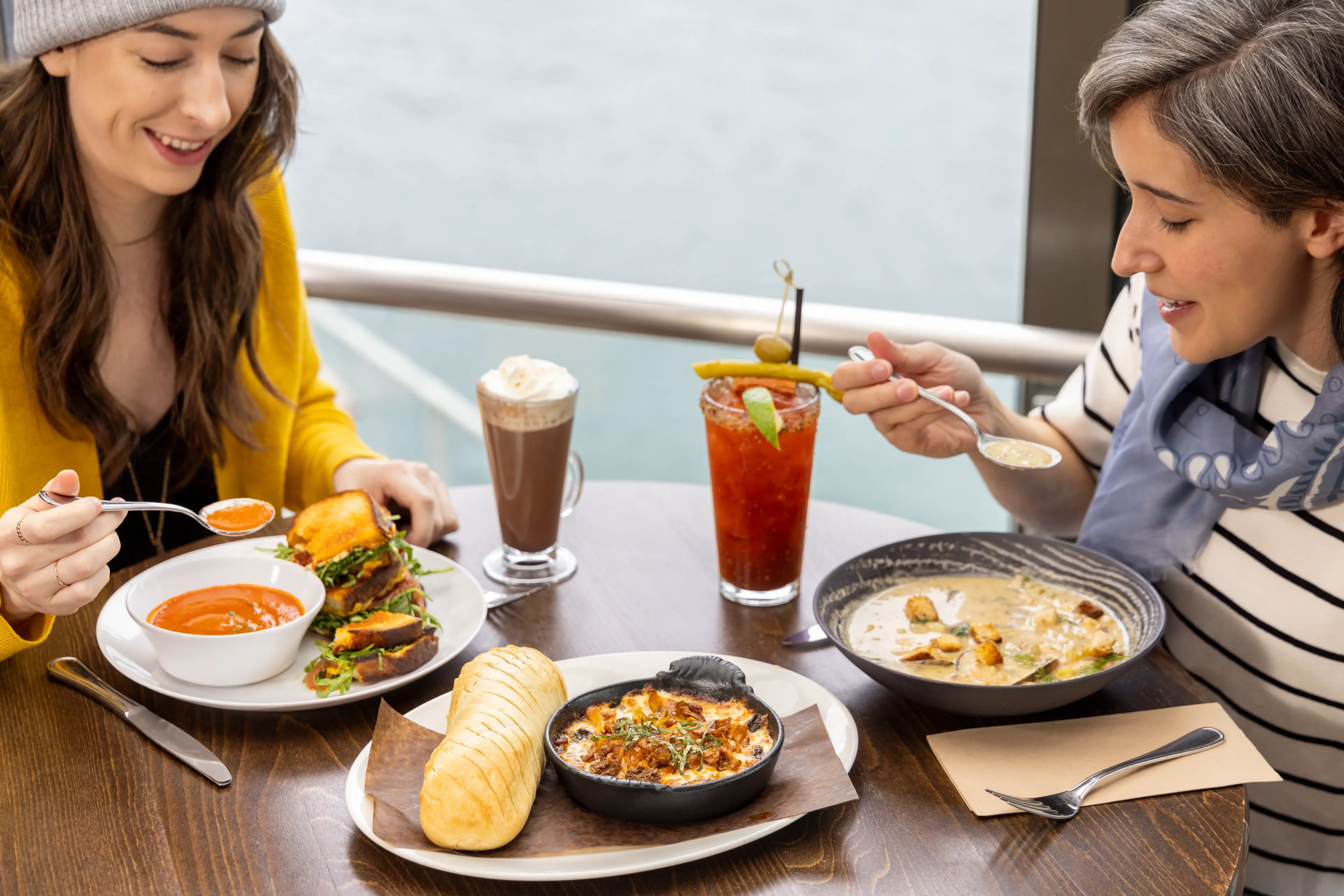 Enjoying a meal together with views of False Creek