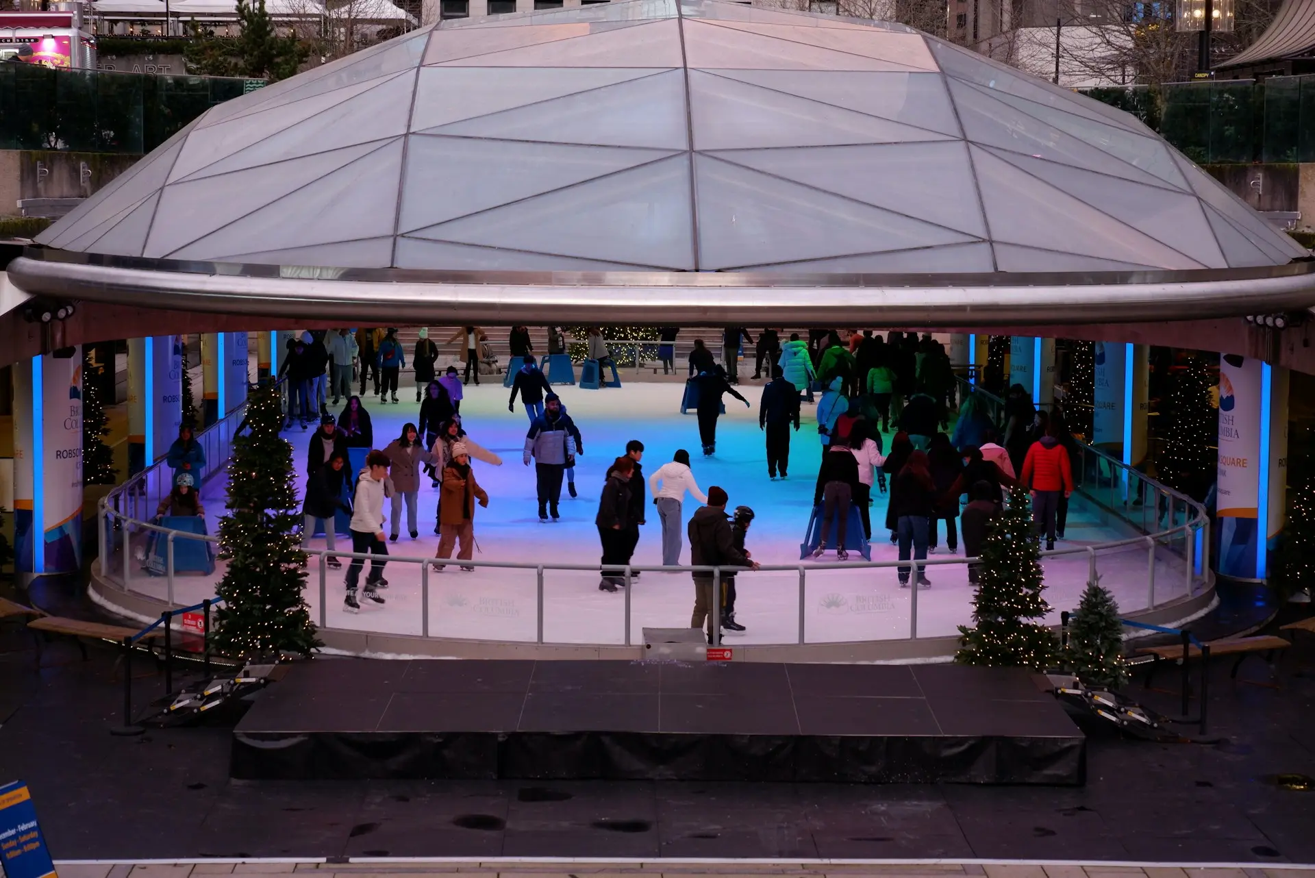 Skaters on the ice at the covered Robson Square Ice Rink in Vancouver.