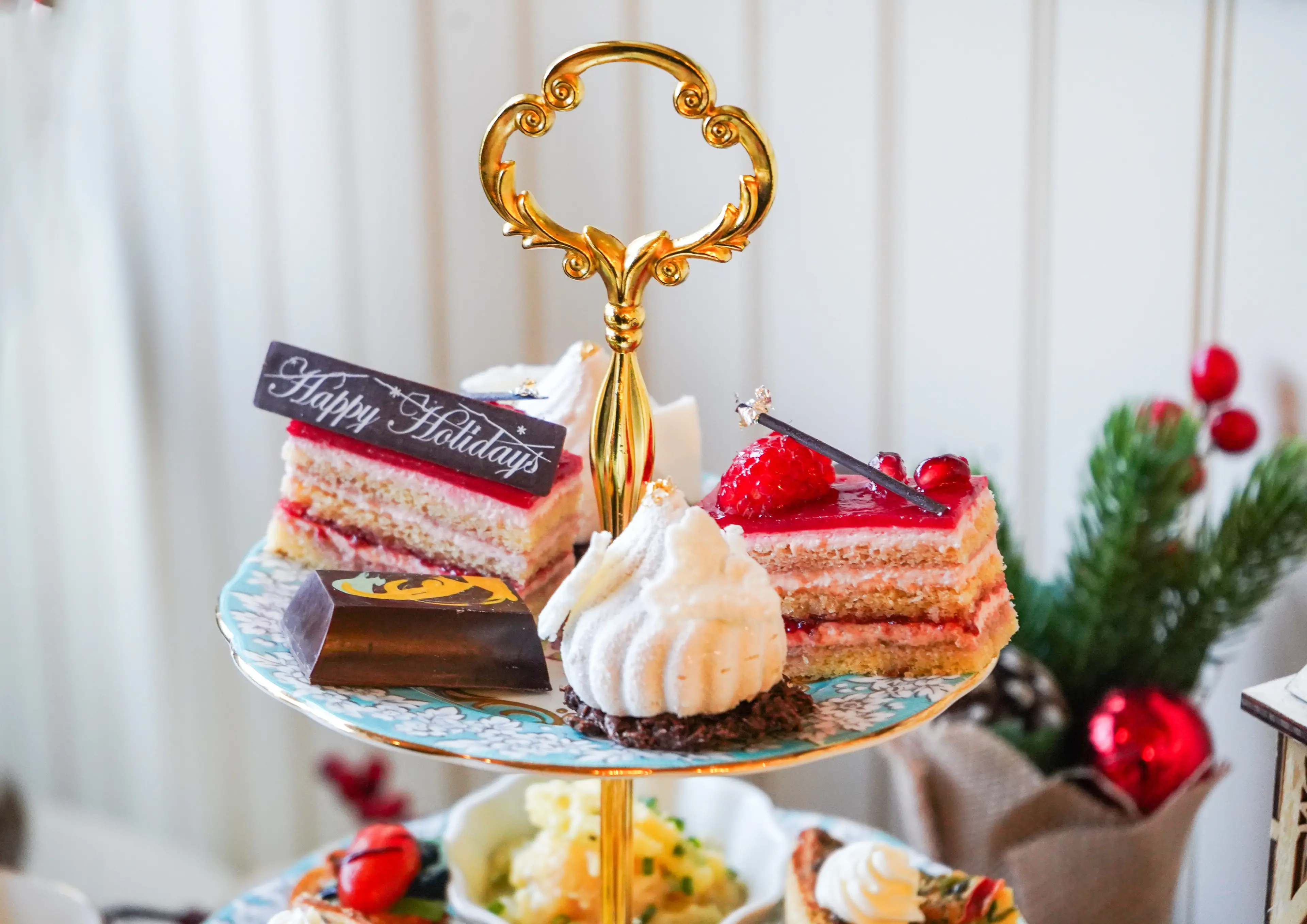 A collection of sweets on a tiered tray at Adonia Tea House