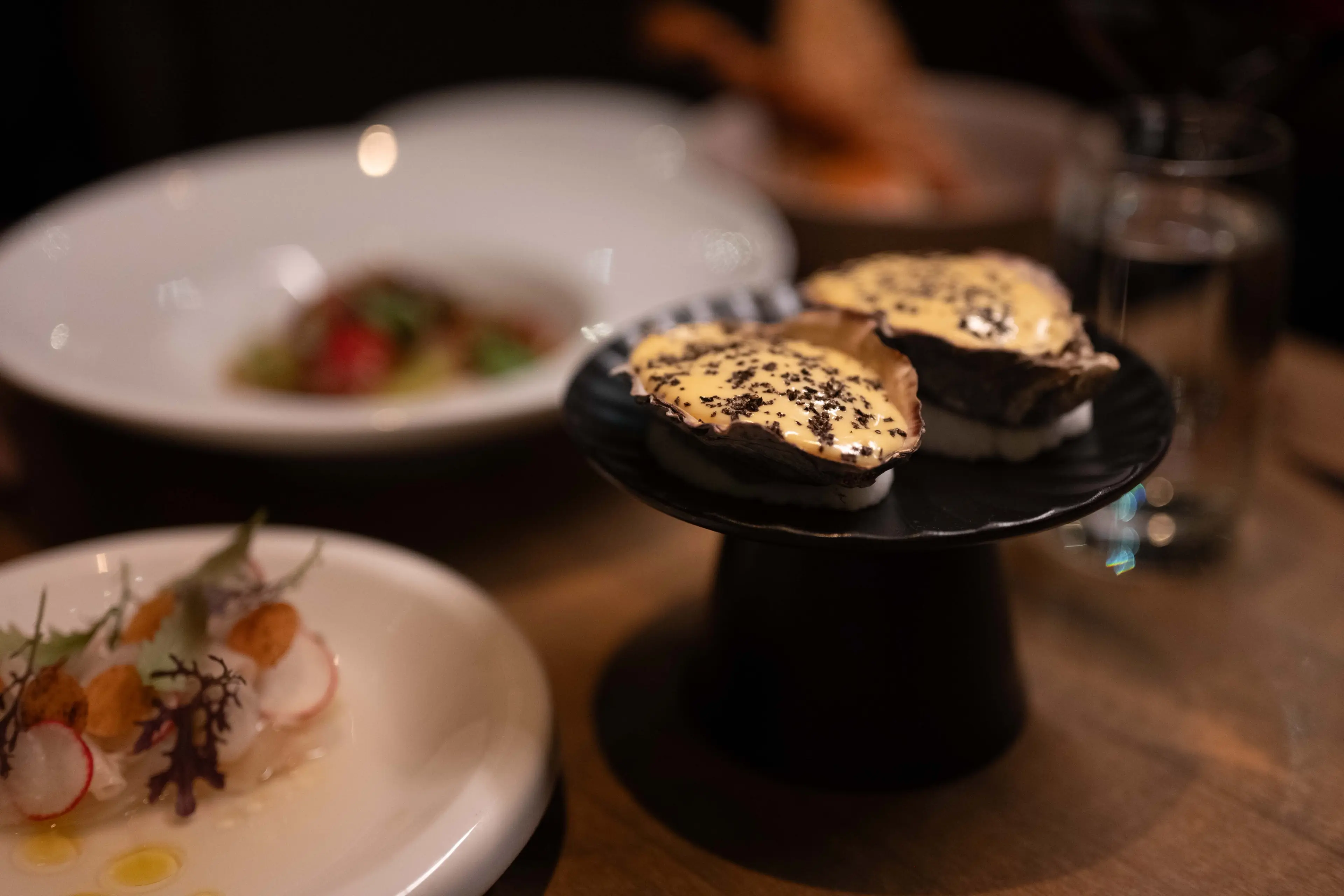 Baked Pacific oysters at L'Abattoir in Vancouver.