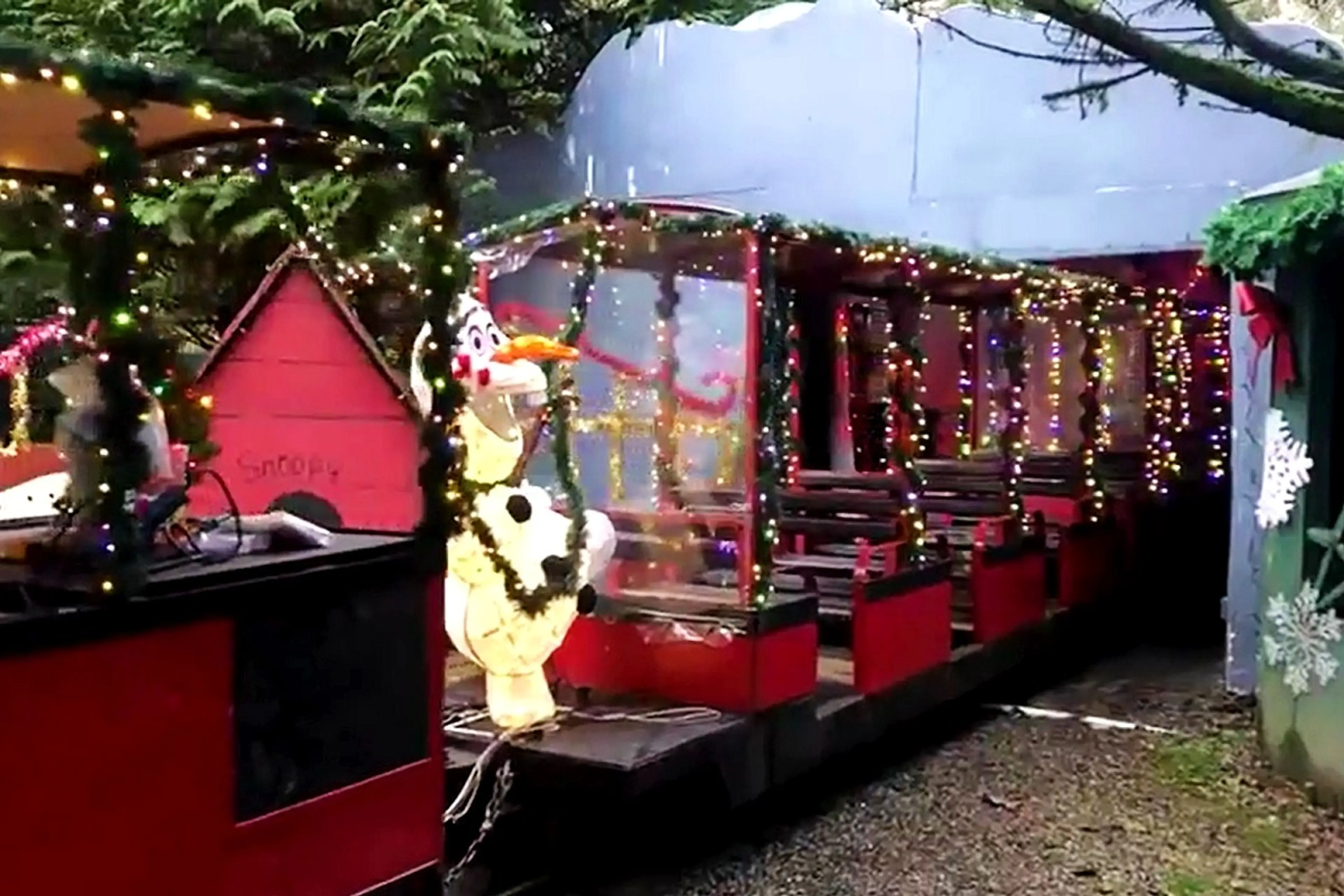 A miniature train decorated with Christmas lights and decor at Bear Creek Park in Surrey