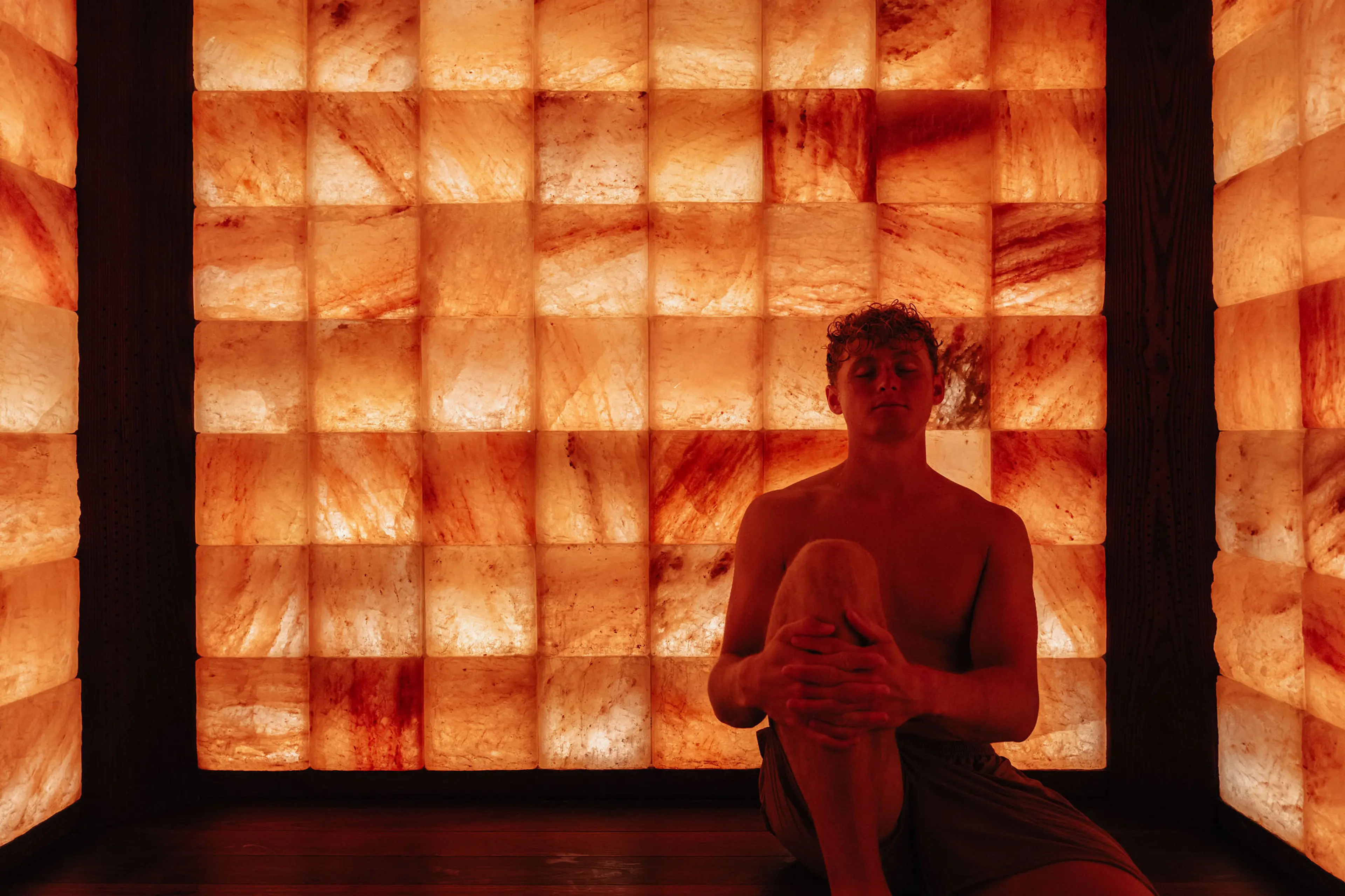 A person sitting in a wellpod at Circle Wellness, Vancouver.