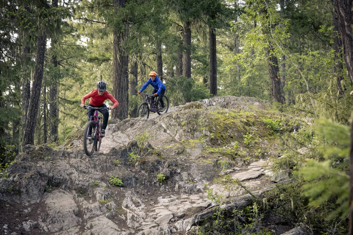 Two mountain bikers on a rocky trails.