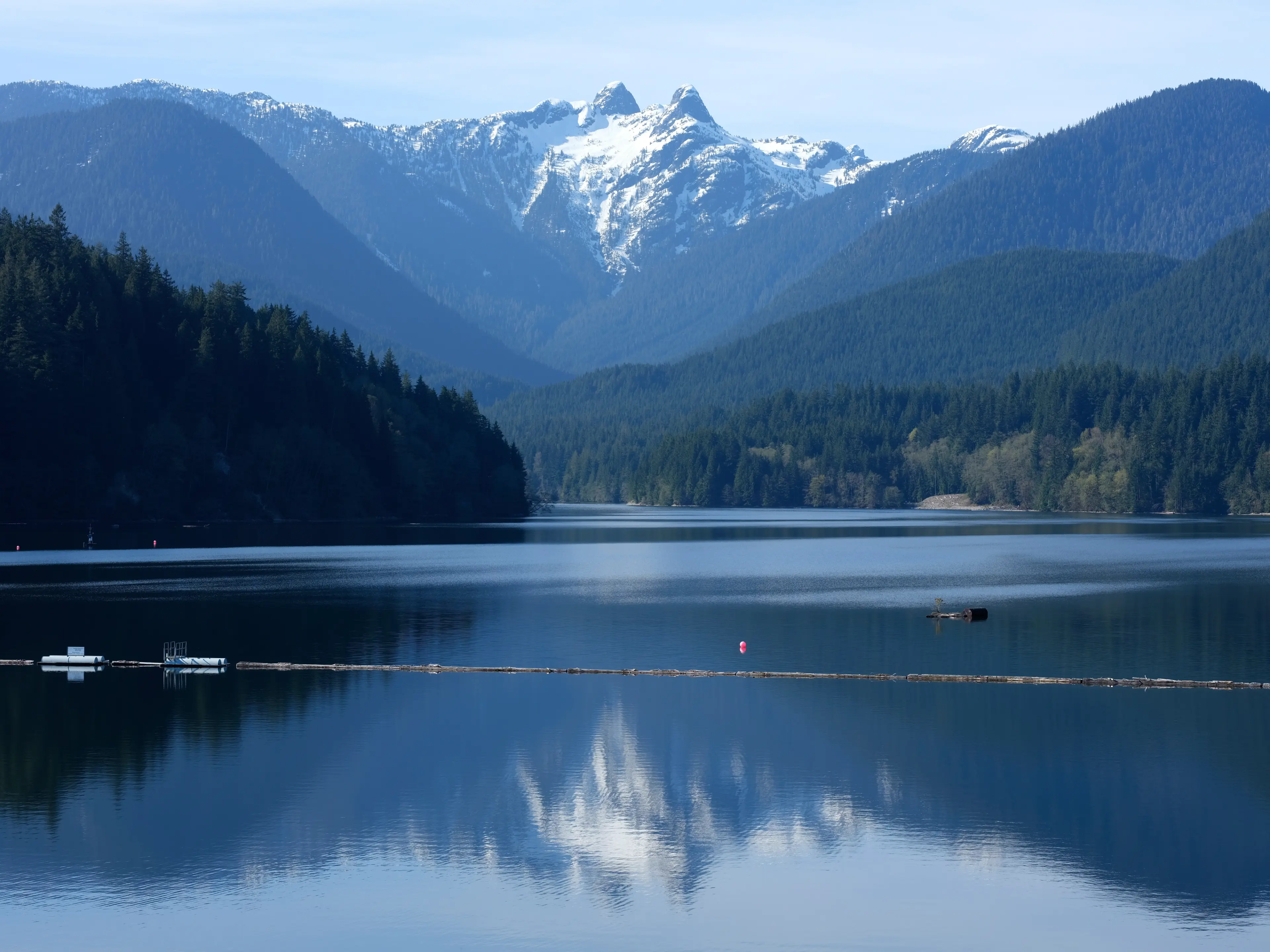 View of Capilano Lake and the Lions Mountains from the top of the Cleveland Dam.