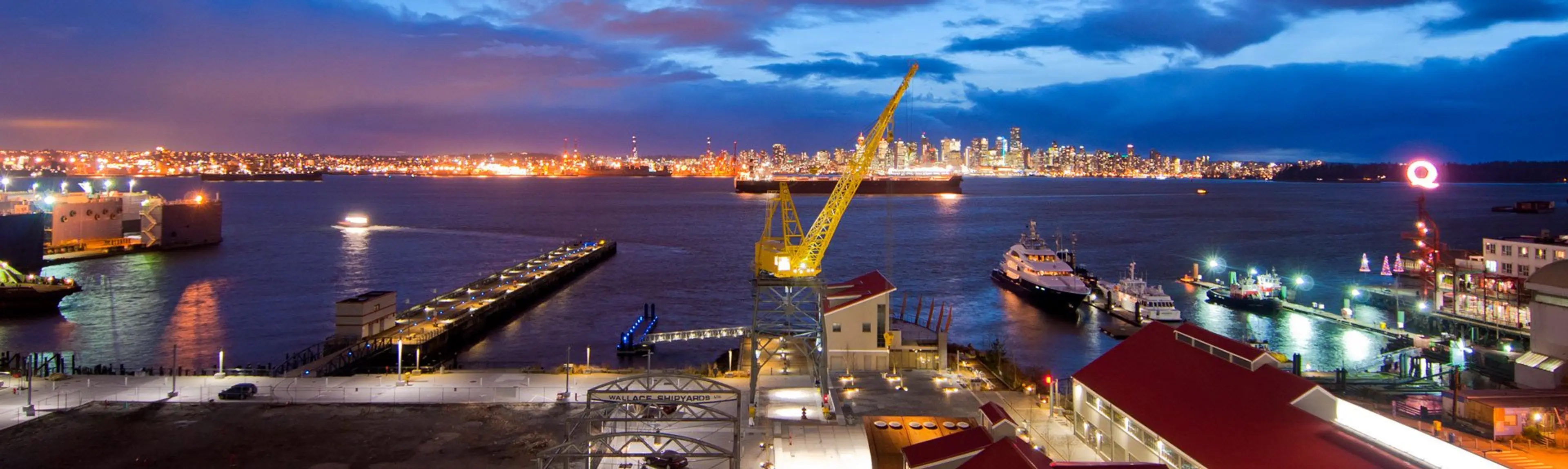 Night view from the Pinnacle Hotel at the Pier in North Vancouver. The Vancouver skyline is lit up across the water