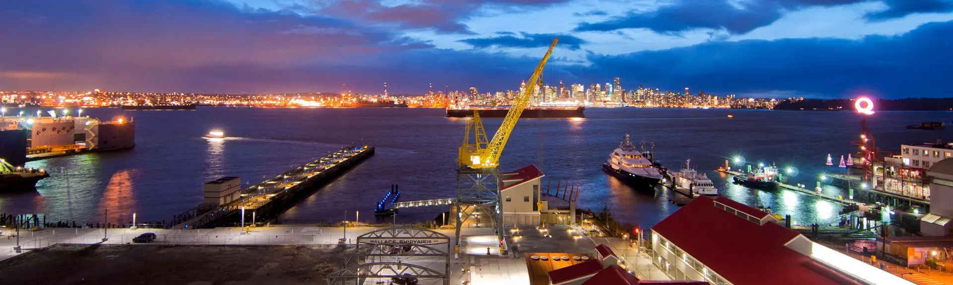 Night view from the Pinnacle Hotel at the Pier in North Vancouver. The Vancouver skyline is lit up across the water