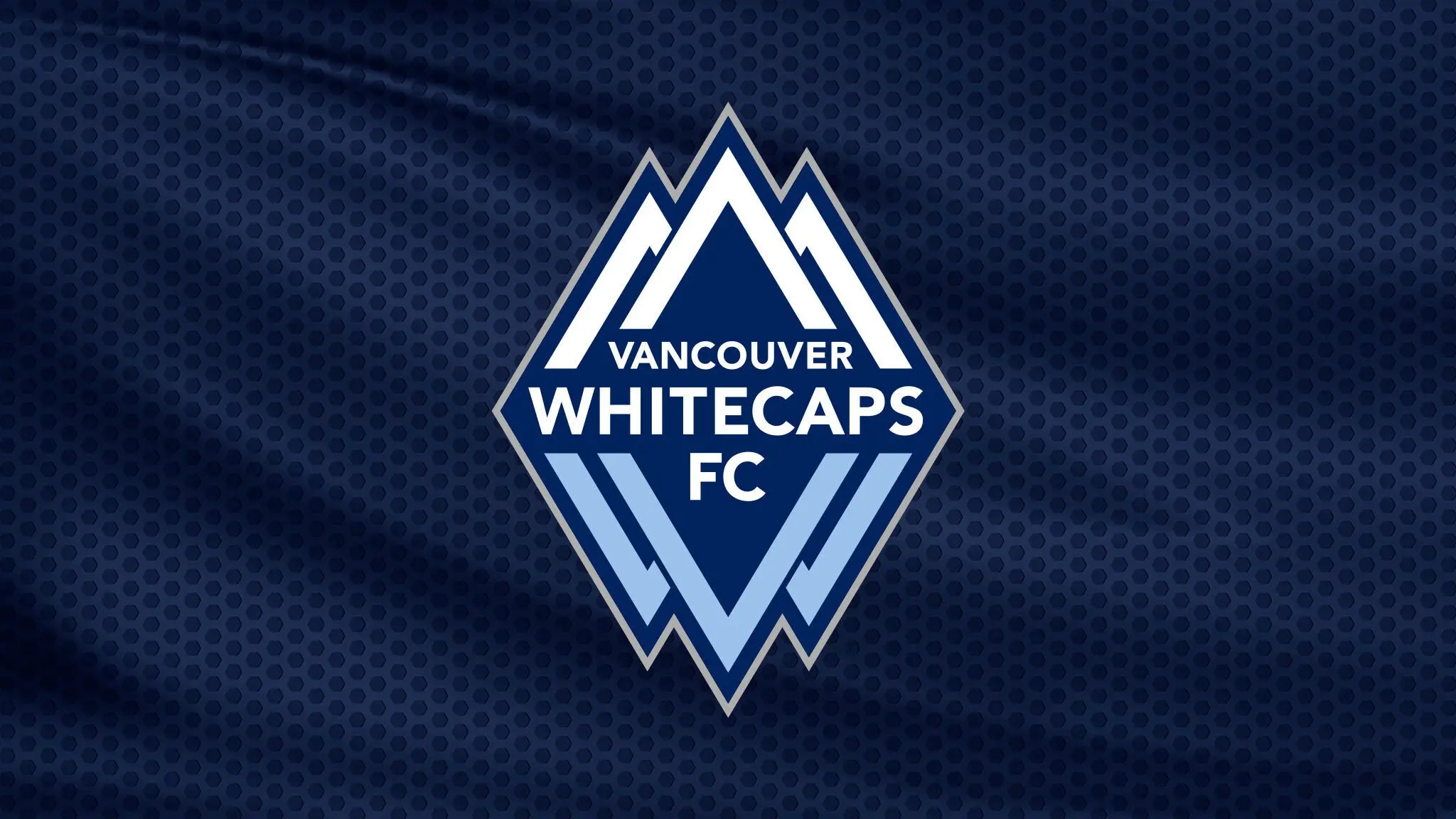 Vancouver Whitecaps FC logo with stylized mountain peaks on a dark blue textured background.
