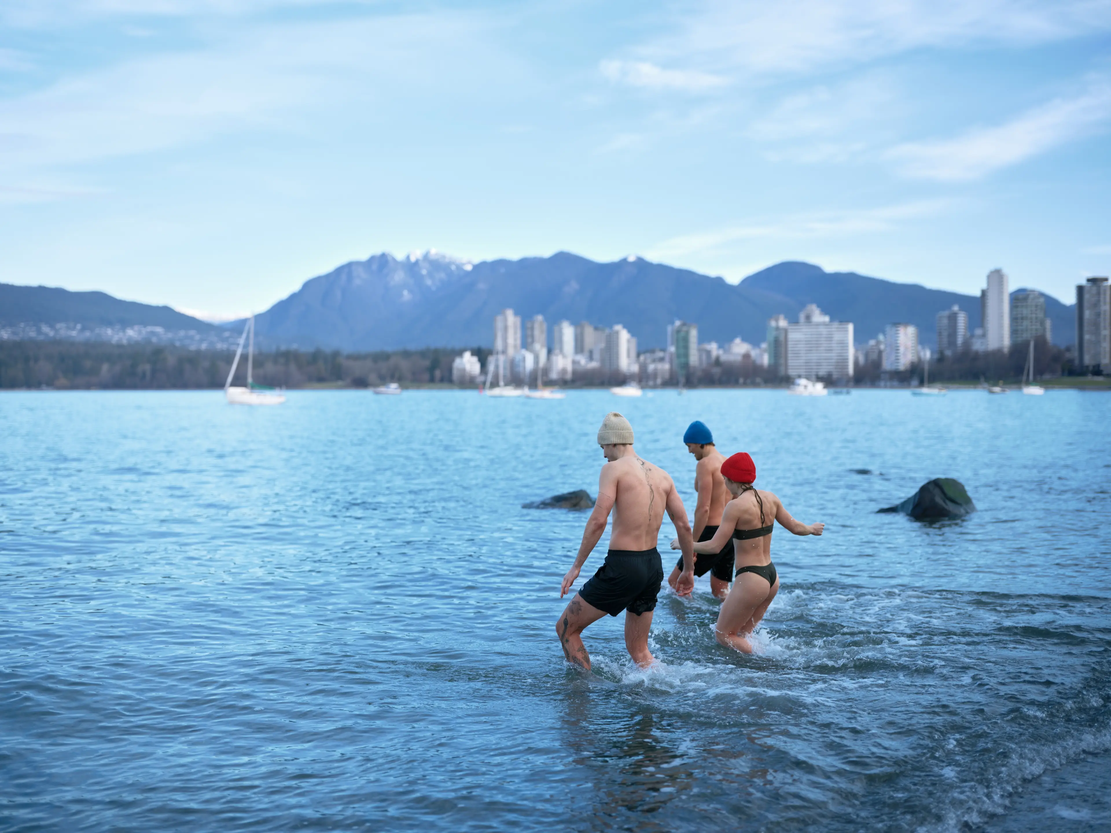 People cold plunge at Kitsilano Beach.