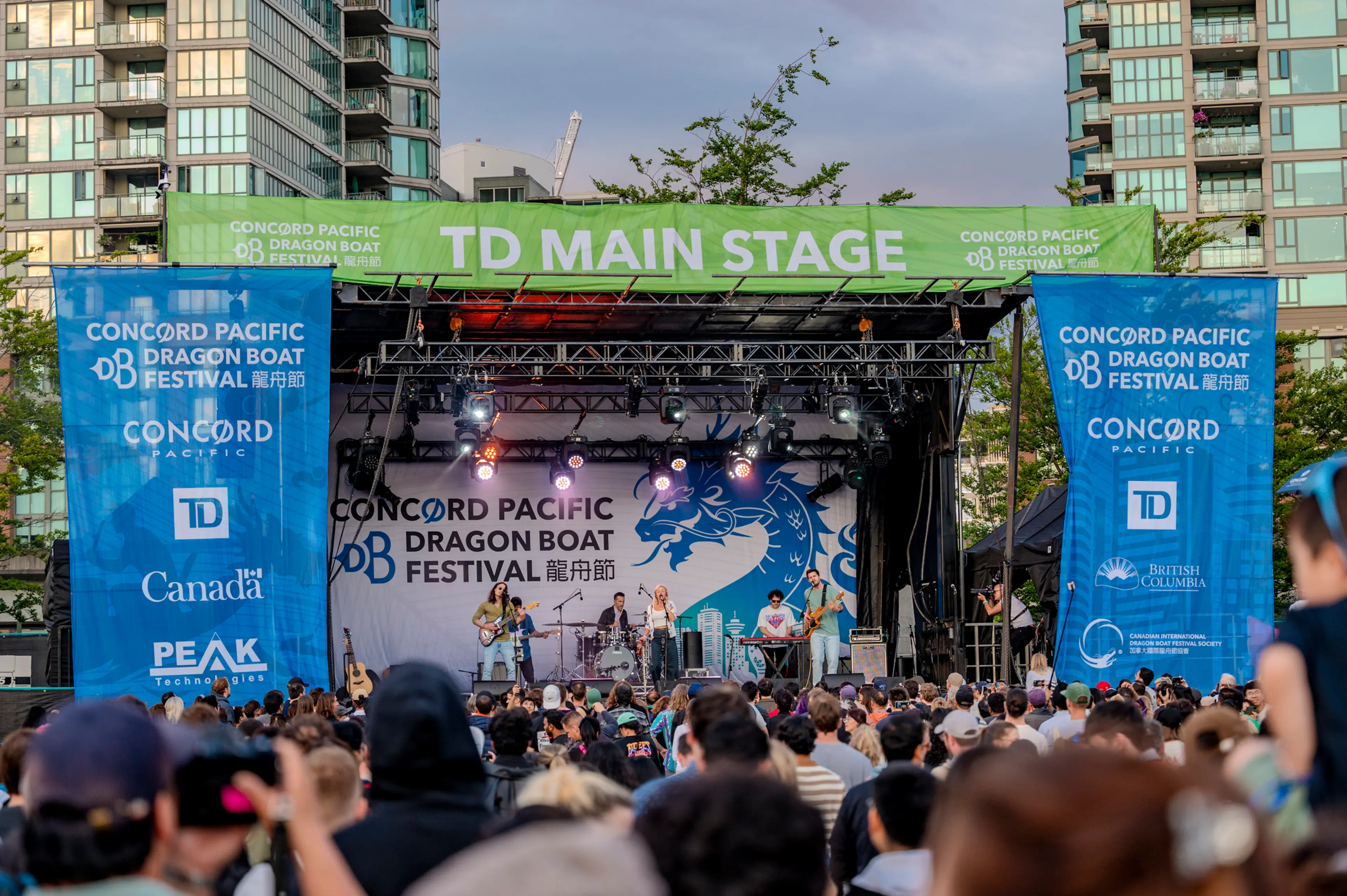 The main stage at the Concord Pacific Dragon Boat Festival with a large crowd watching