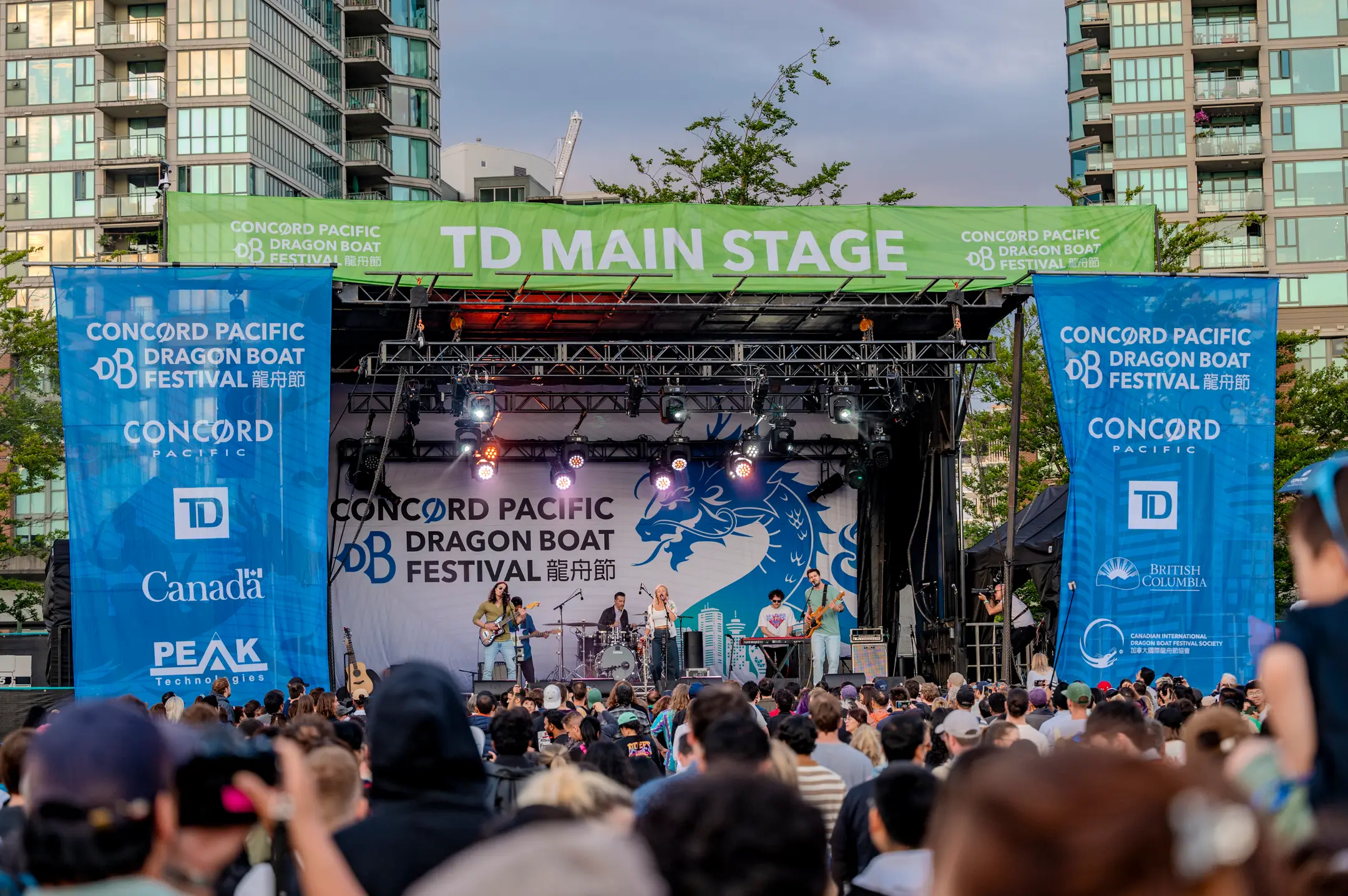 The main stage at the Concord Pacific Dragon Boat Festival with a large crowd watching