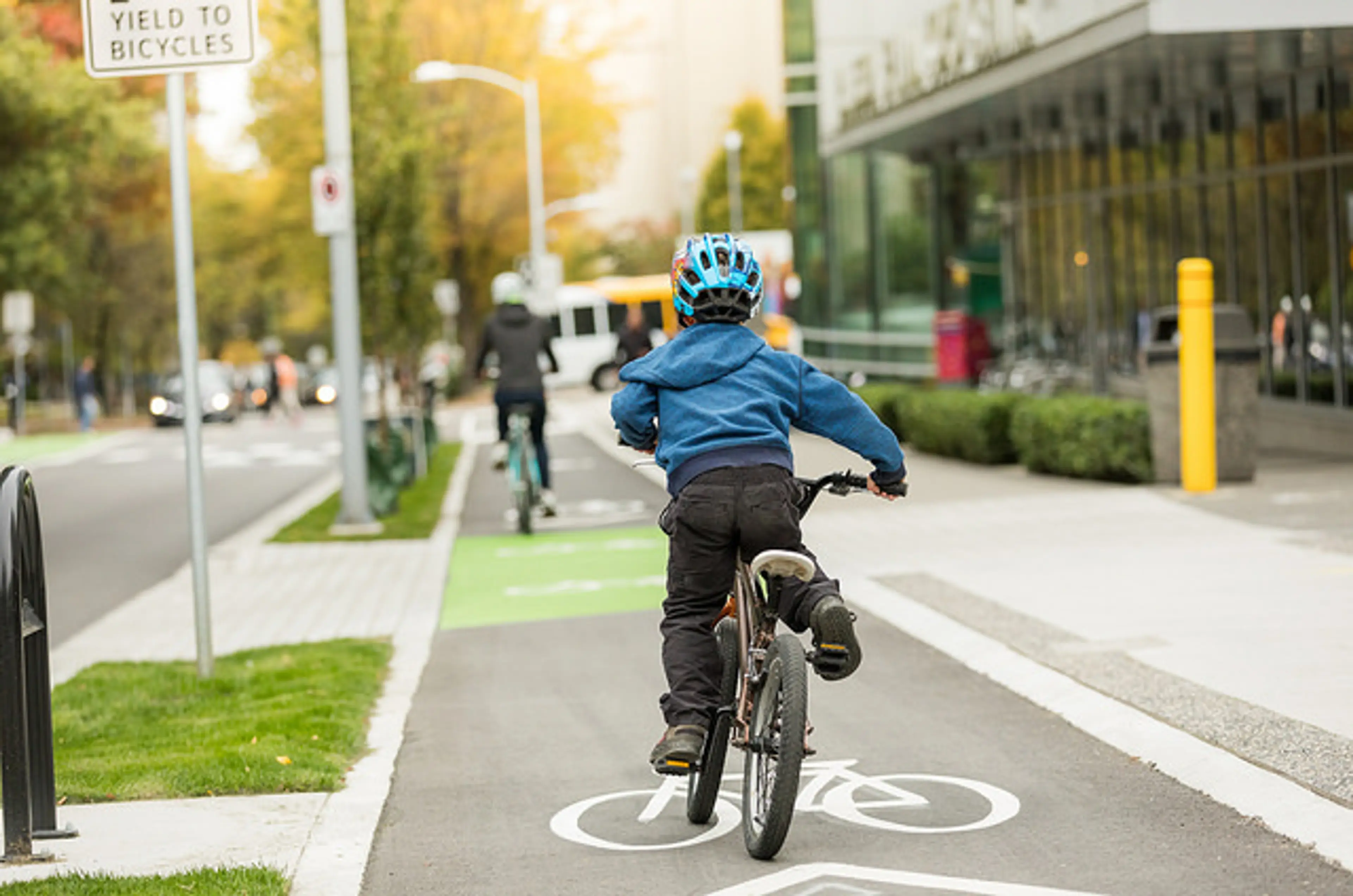 A child riding in a bike lane in Vancouver