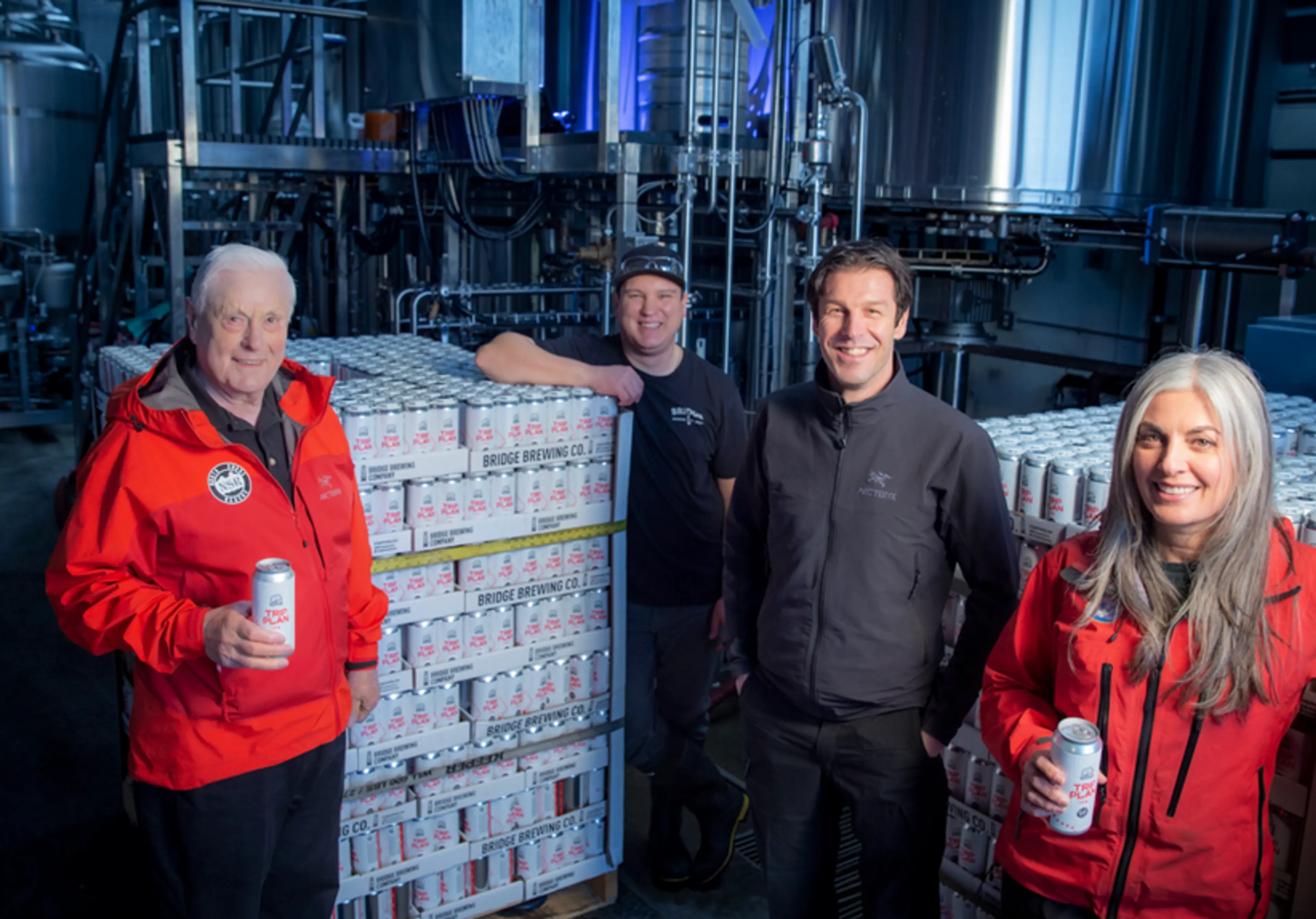 Members of North Shore Rescue pose with Bridge Brewing Trip Plan IPA