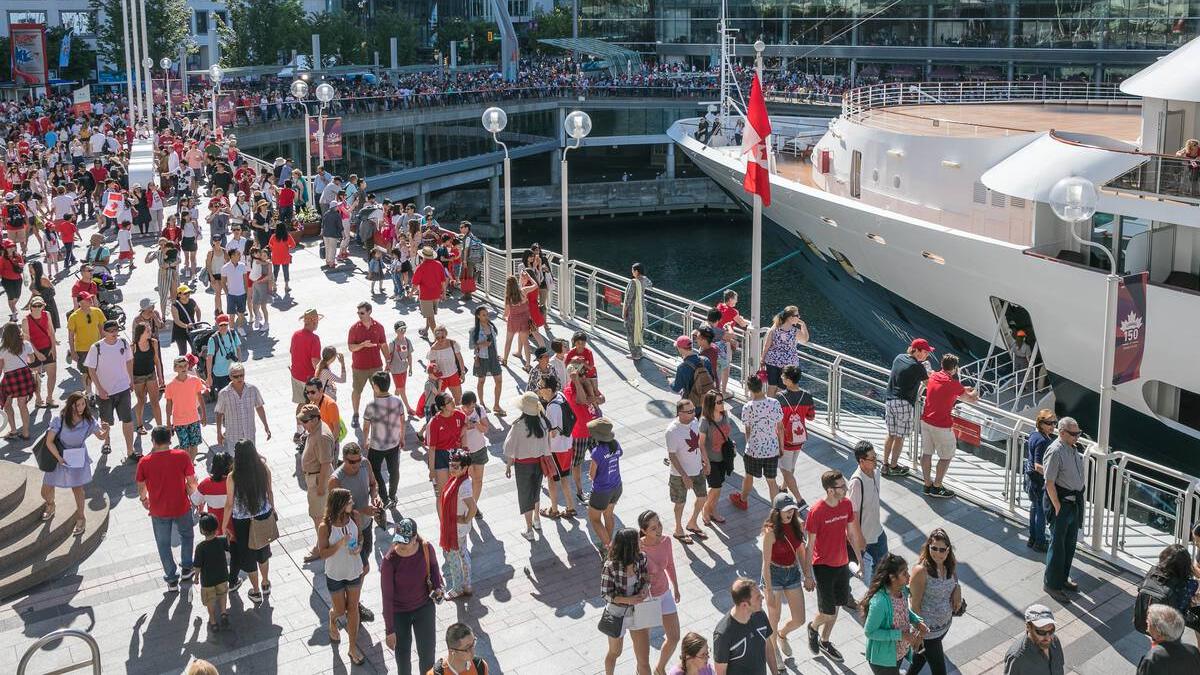 People dressed in red, gathered for Canada Day celebrations