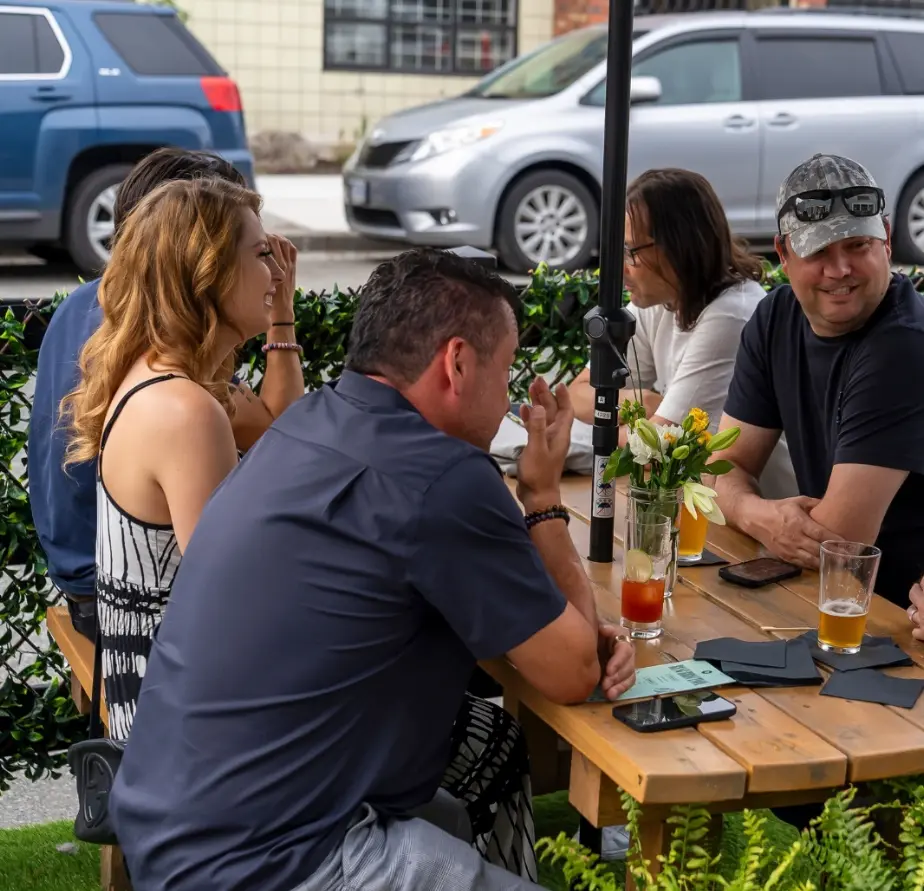 People sit on the patio at Resurrection Spirits in Vancouver