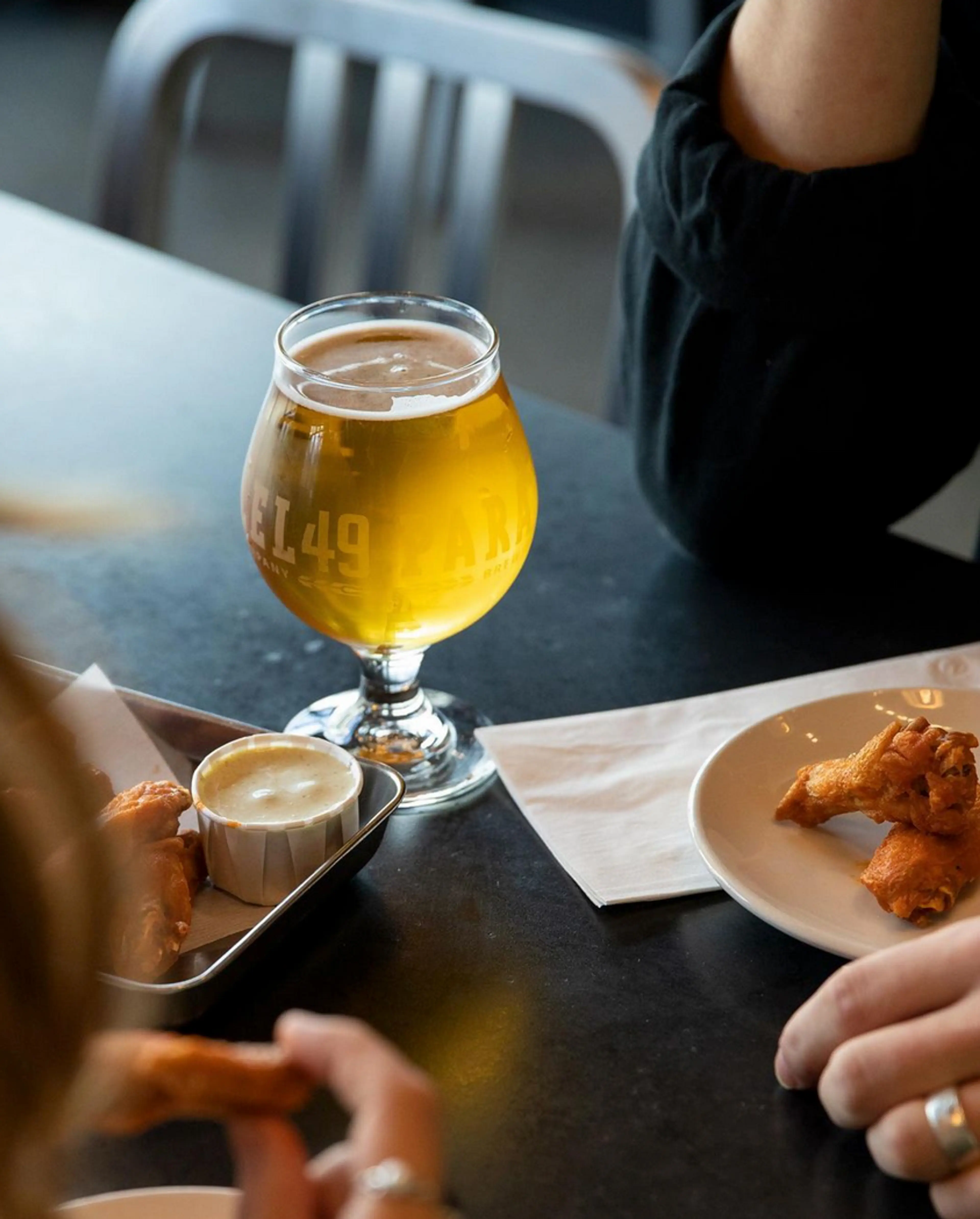 Table with beer and snacks at Parallel 49 Brewing in Vancouver