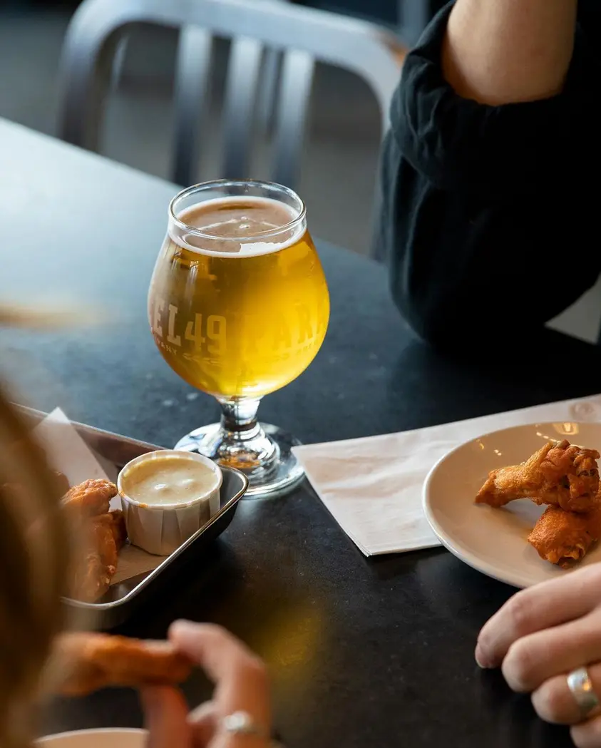 Table with beer and snacks at Parallel 49 Brewing in Vancouver