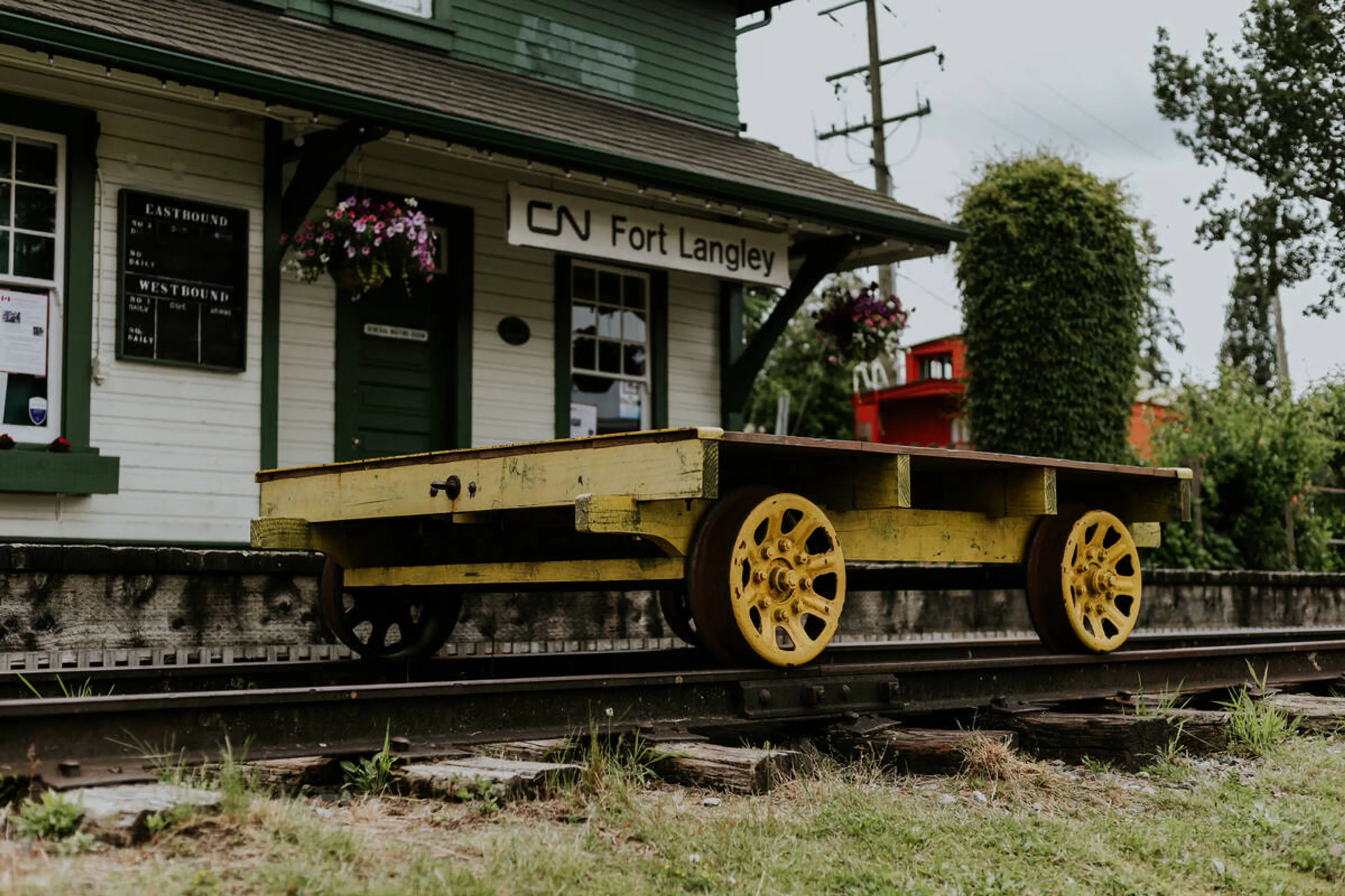 CN Fort Langley train station sign with rail trolley.